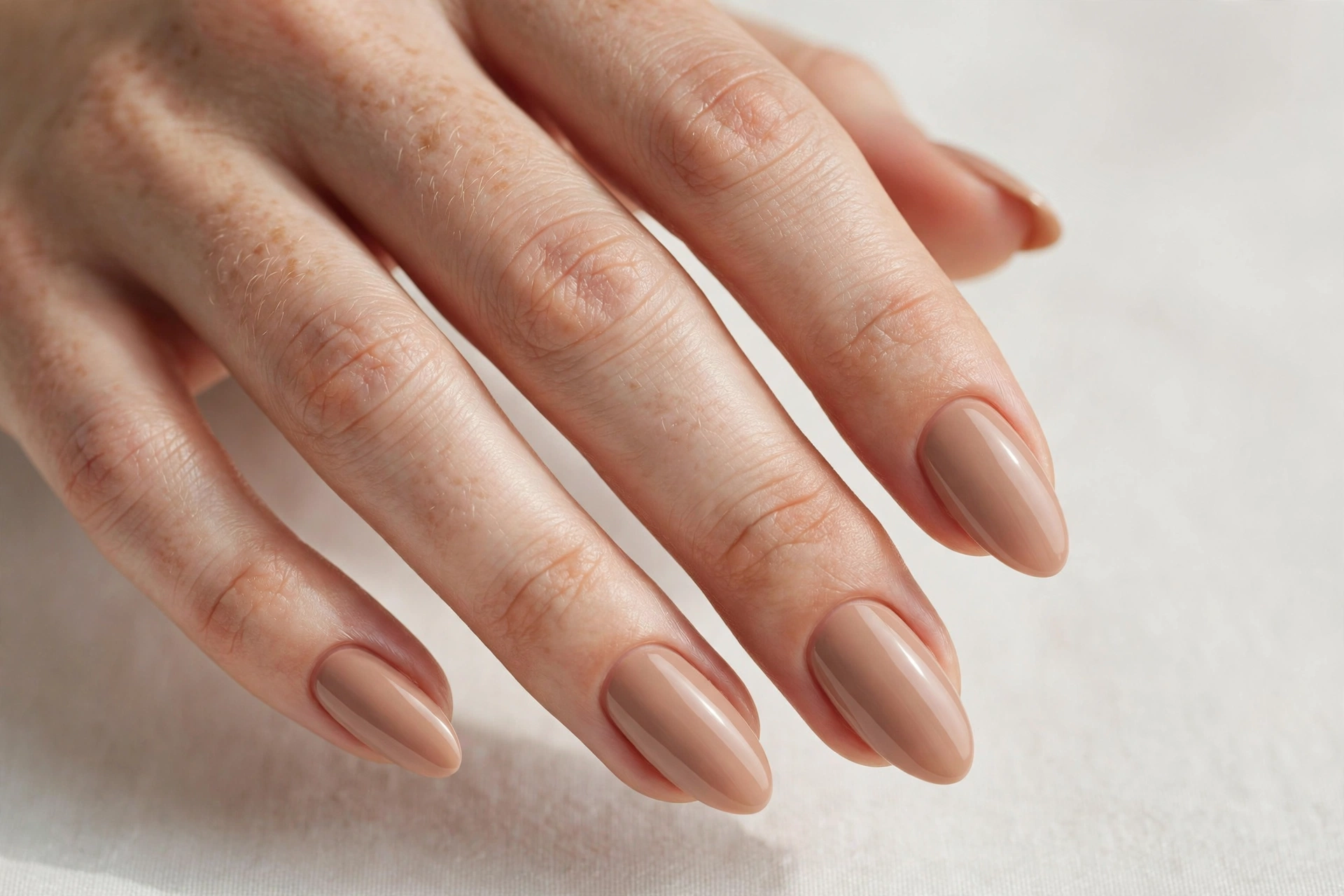 Warm nude solid manicure with glossy finish