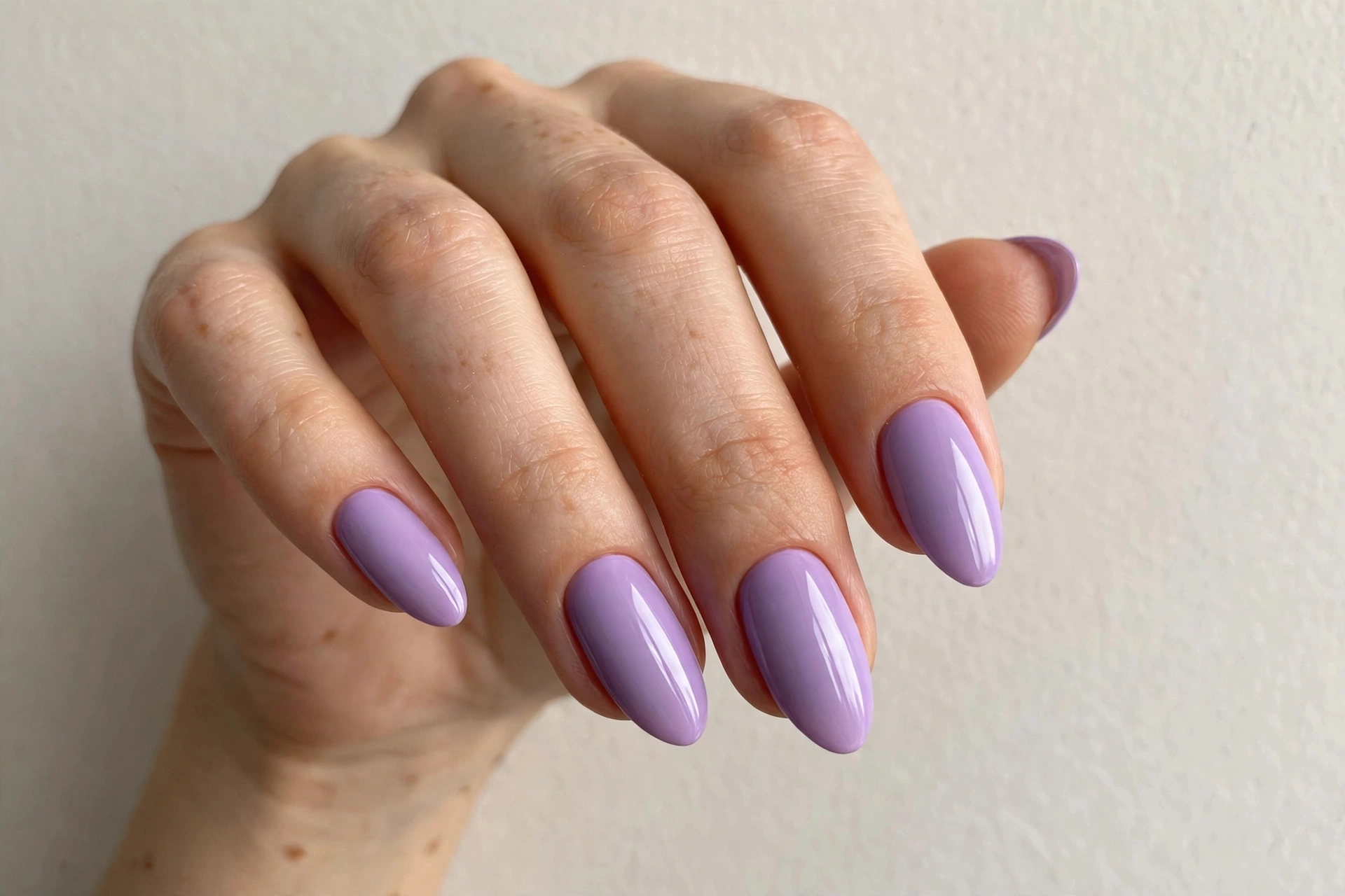 Soft lilac purple manicure with glossy finish