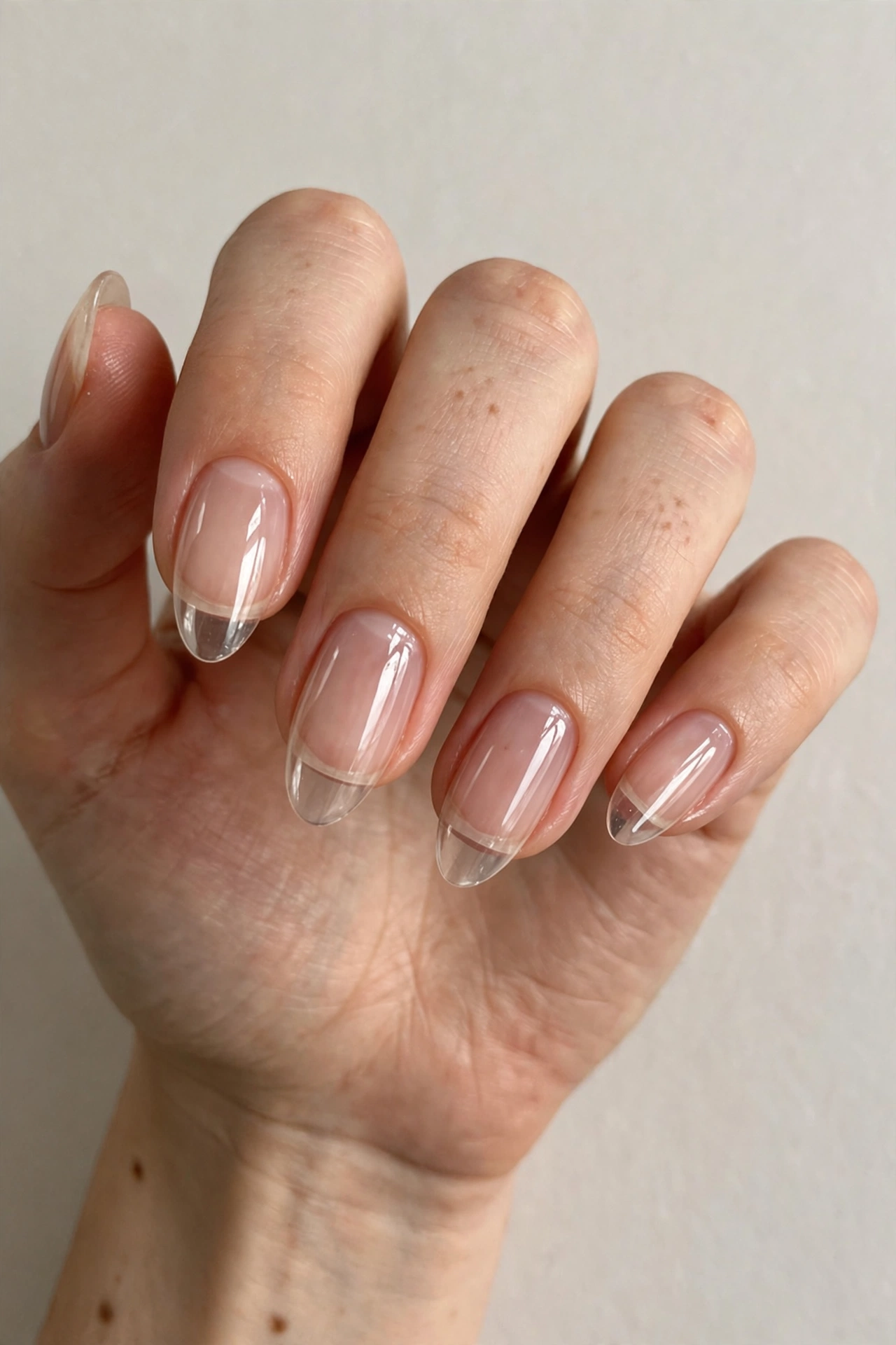 Clear glossy manicure with high shine on natural nails