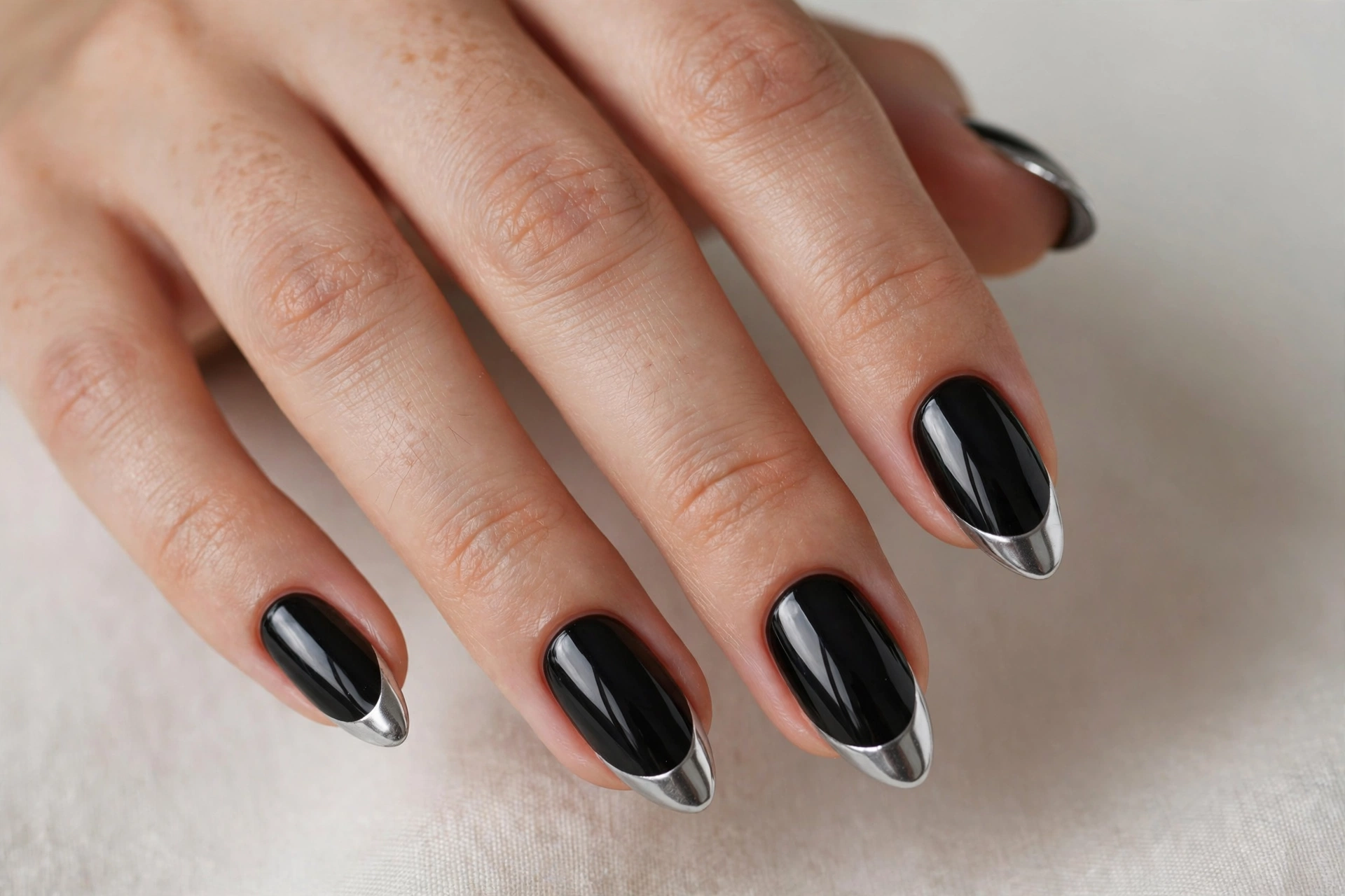 Black nails with silver chrome tips