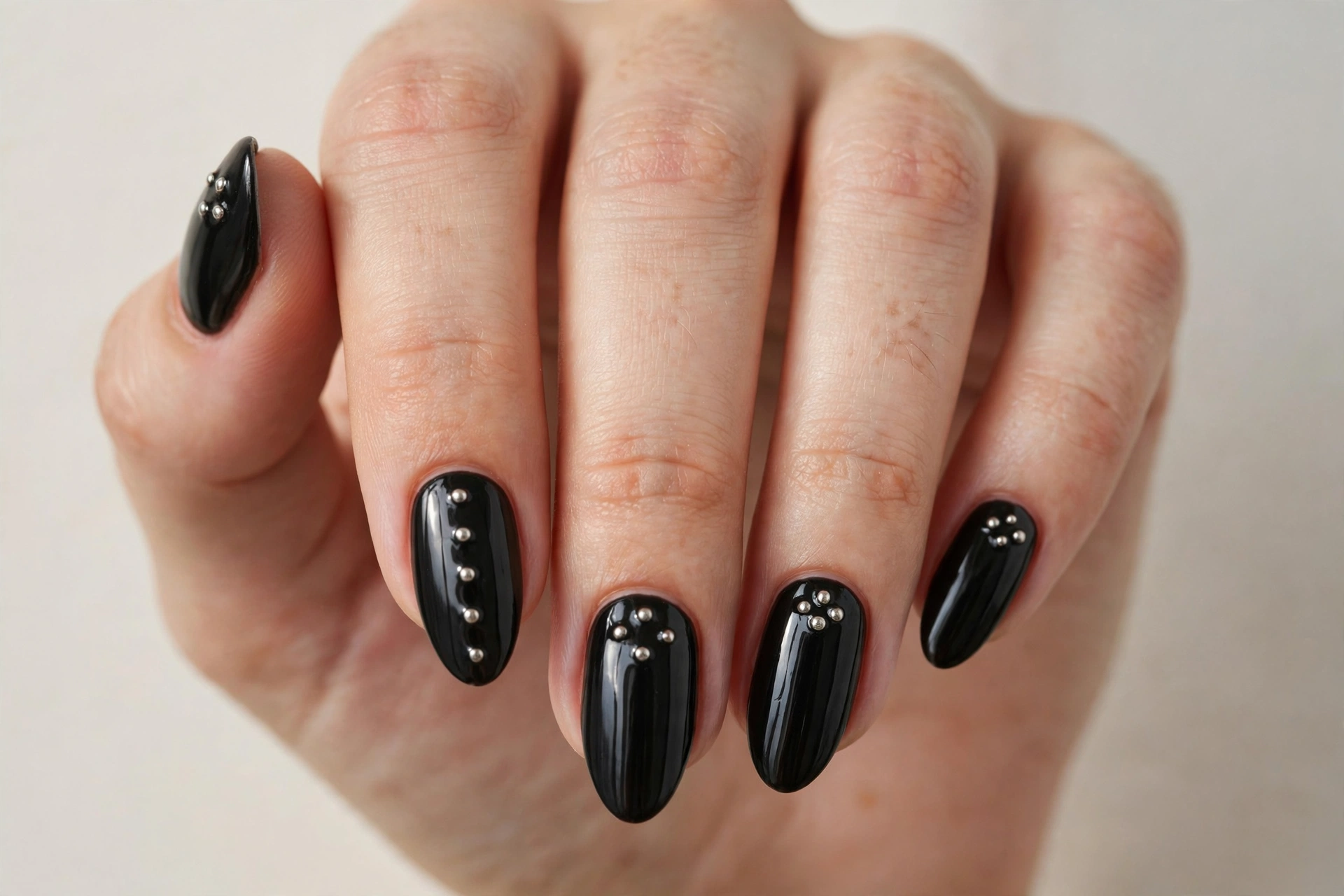Black nails with small silver studs