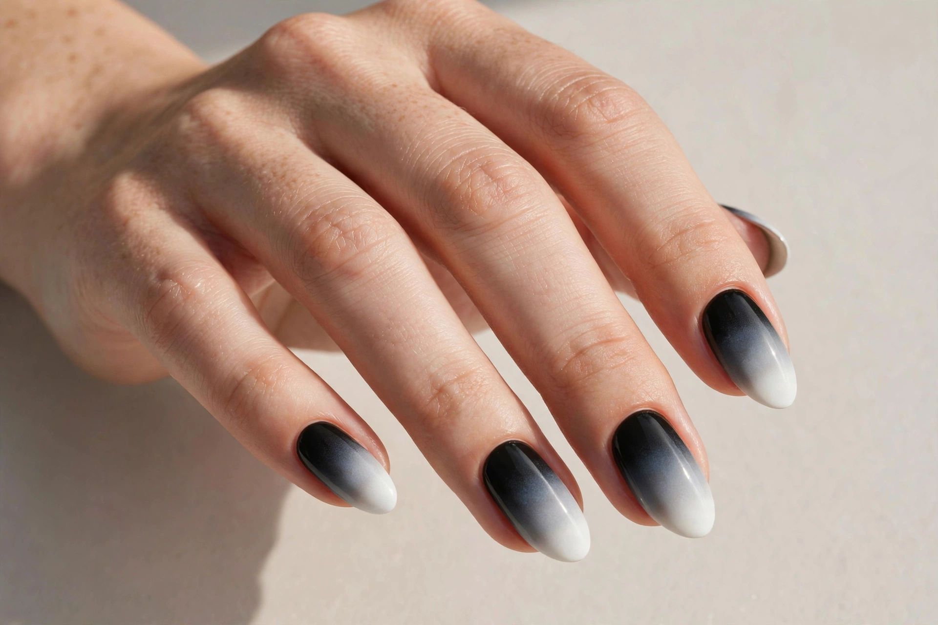 Smooth black to white ombre gradient nails