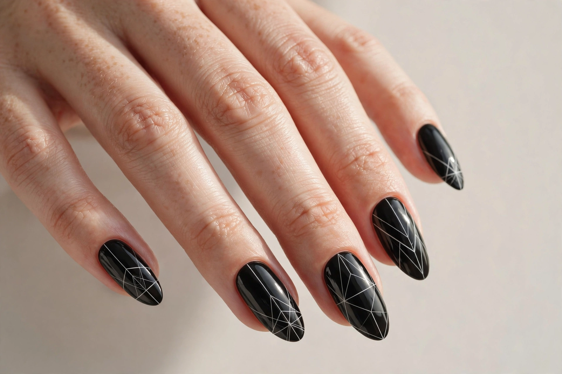 Black nails with white geometric line art