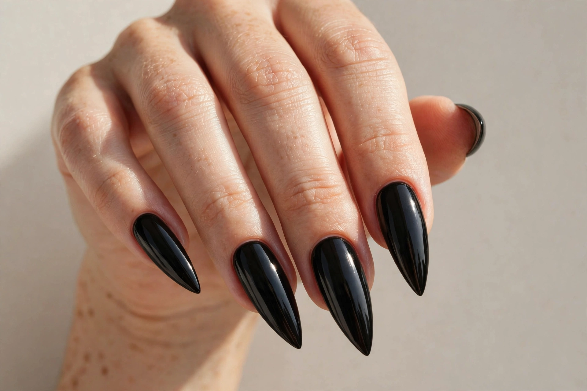 Dramatic black stiletto nails