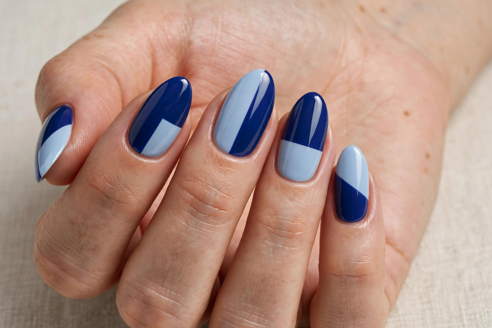 Deep blue and light blue color block nail art