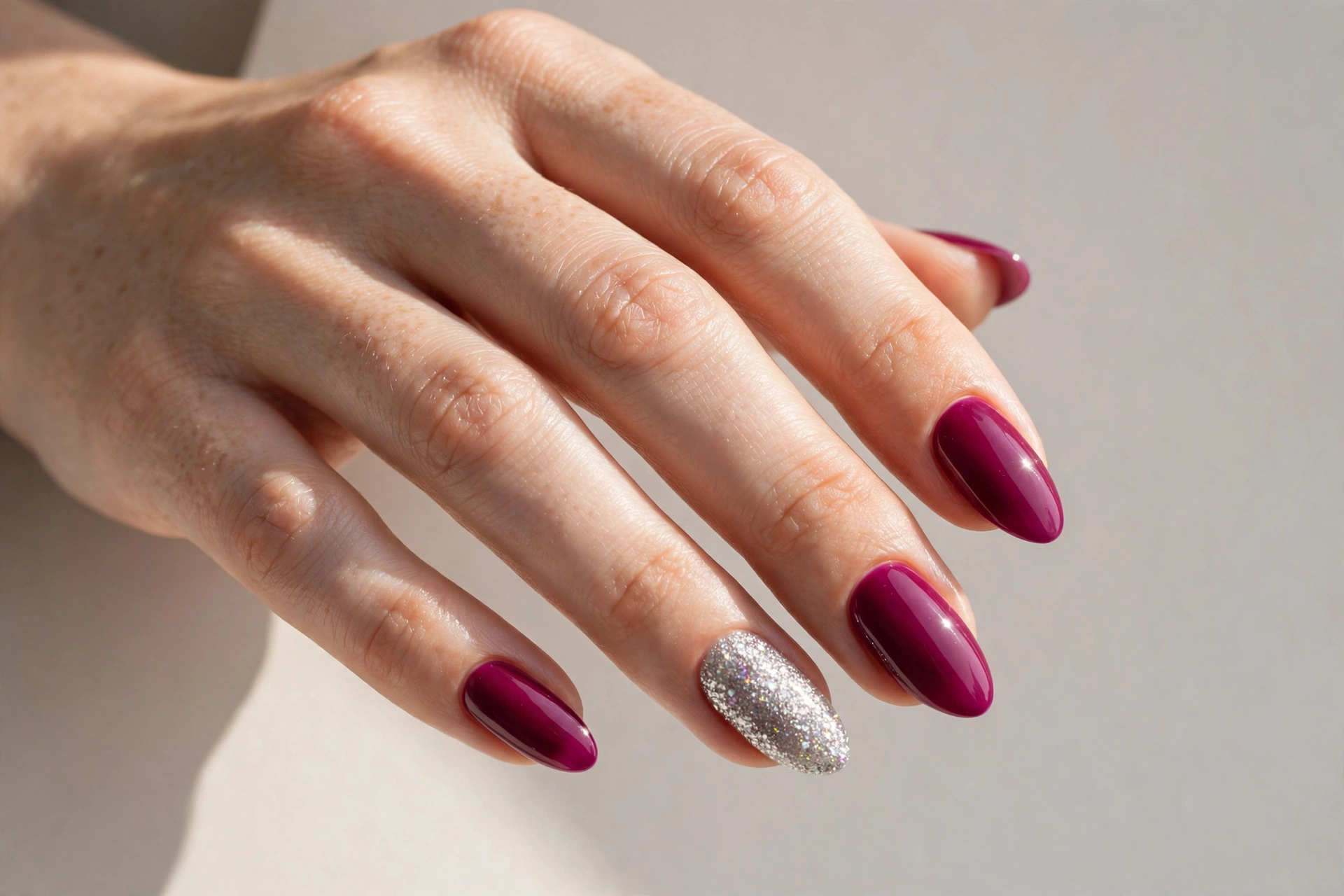 Deep magenta pink nails with a silver glitter accent nail