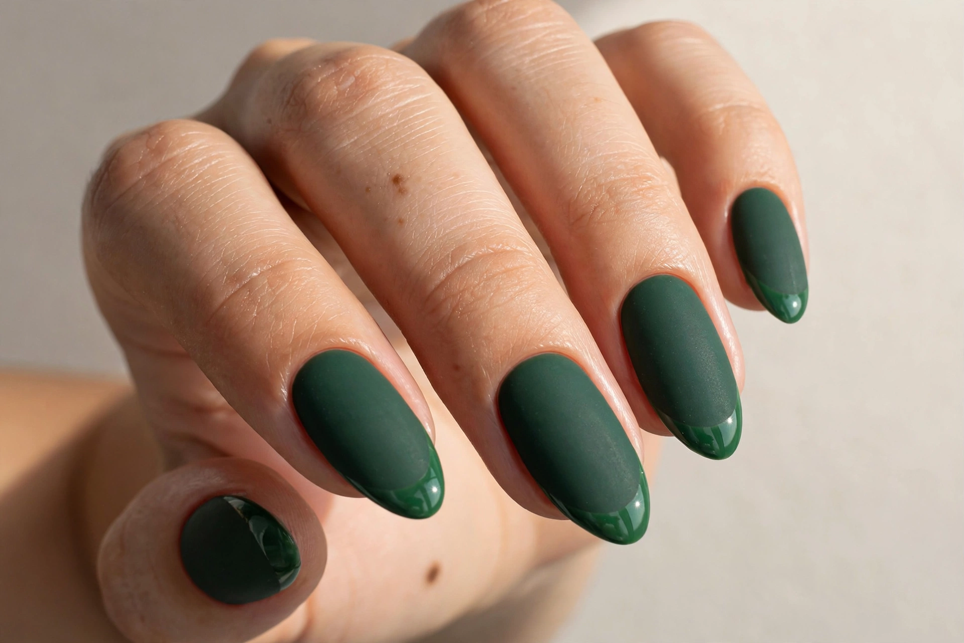 Matte forest green Christmas nails with glossy French tips