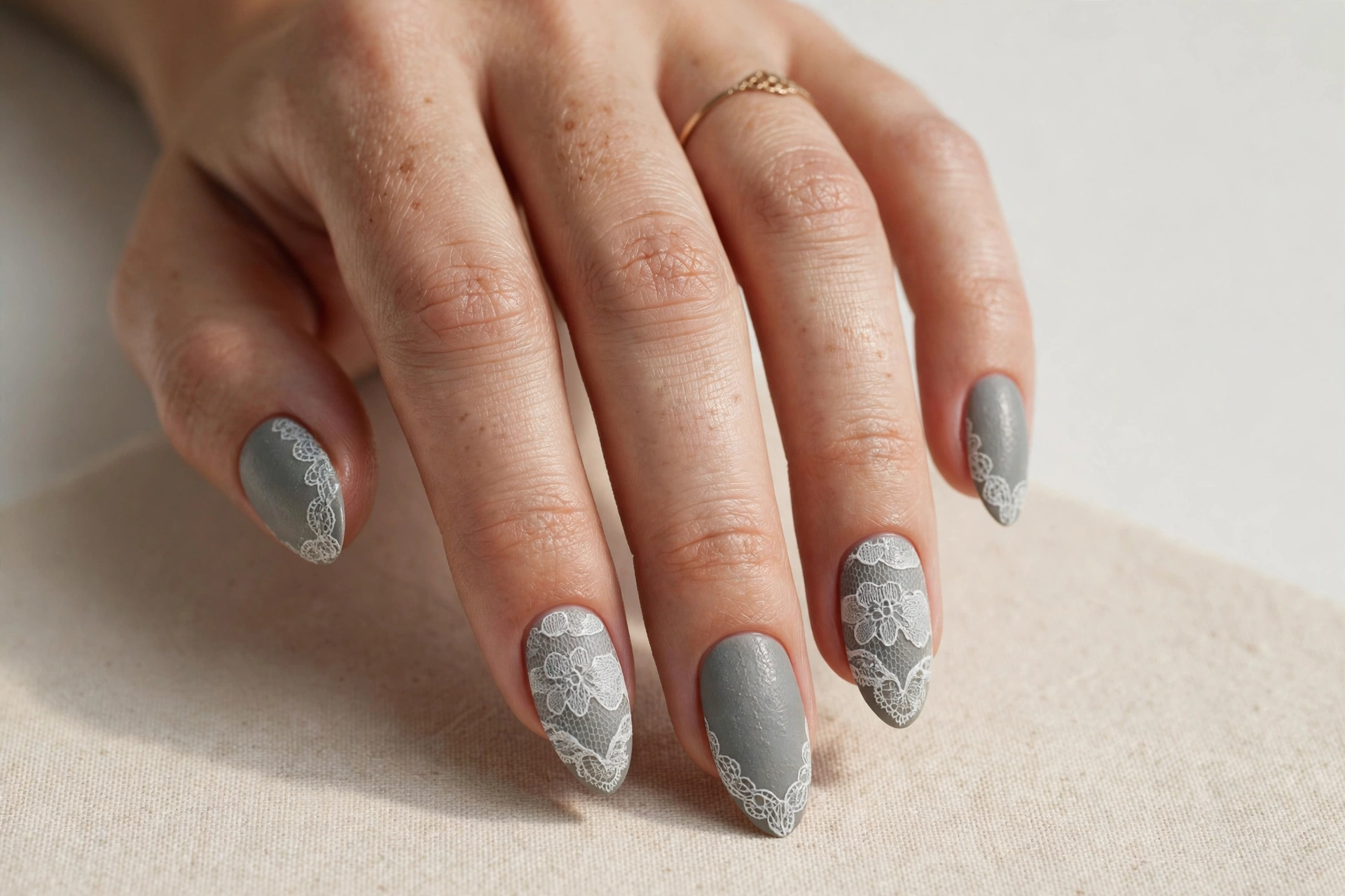 Vintage gray manicure with delicate lace pattern detailing