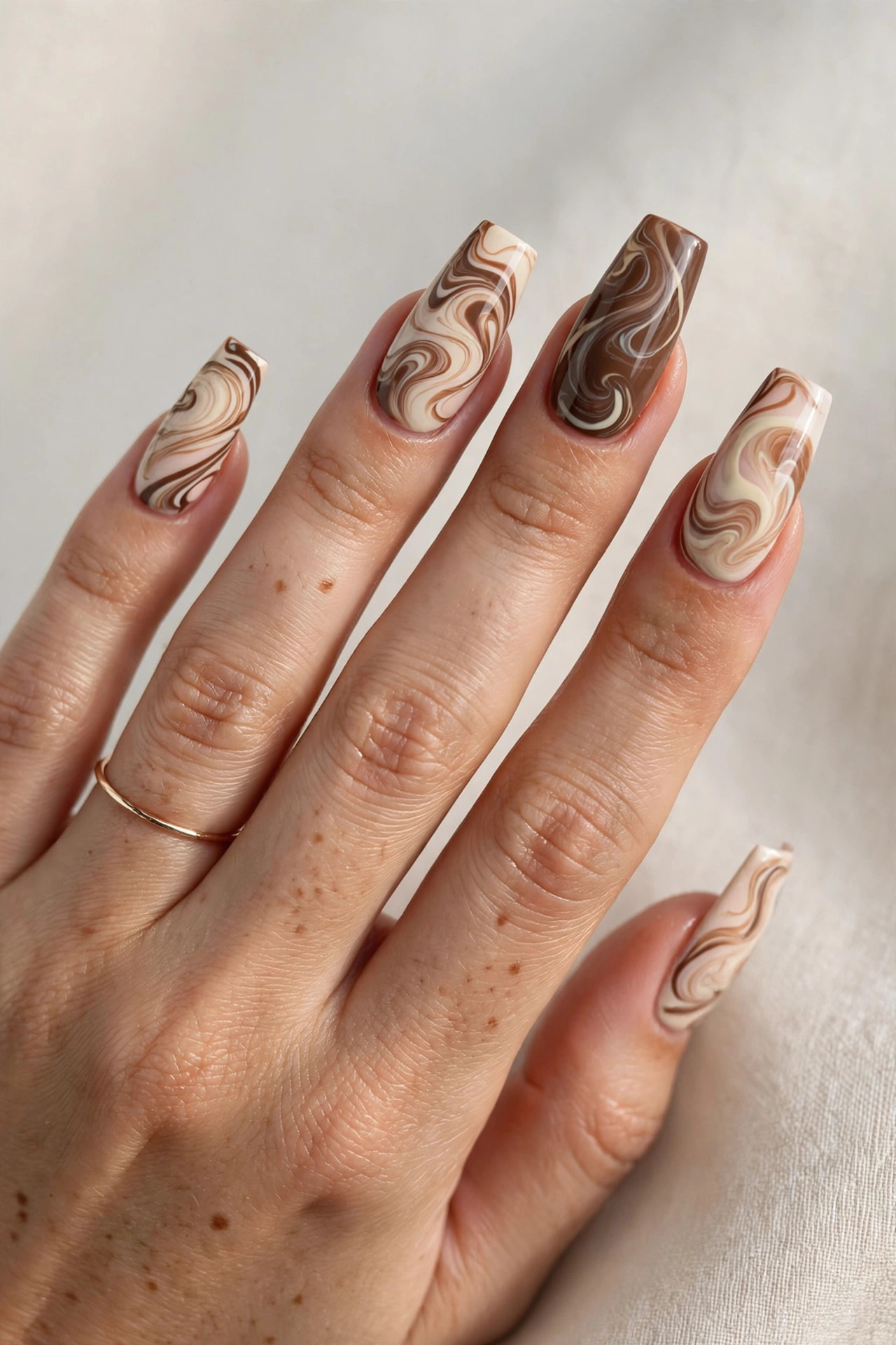 Brown and cream abstract swirl coffin nails