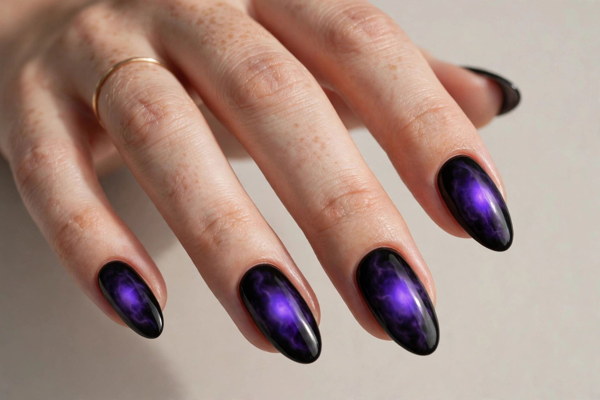 Black nails with electric purple aura cool nail design