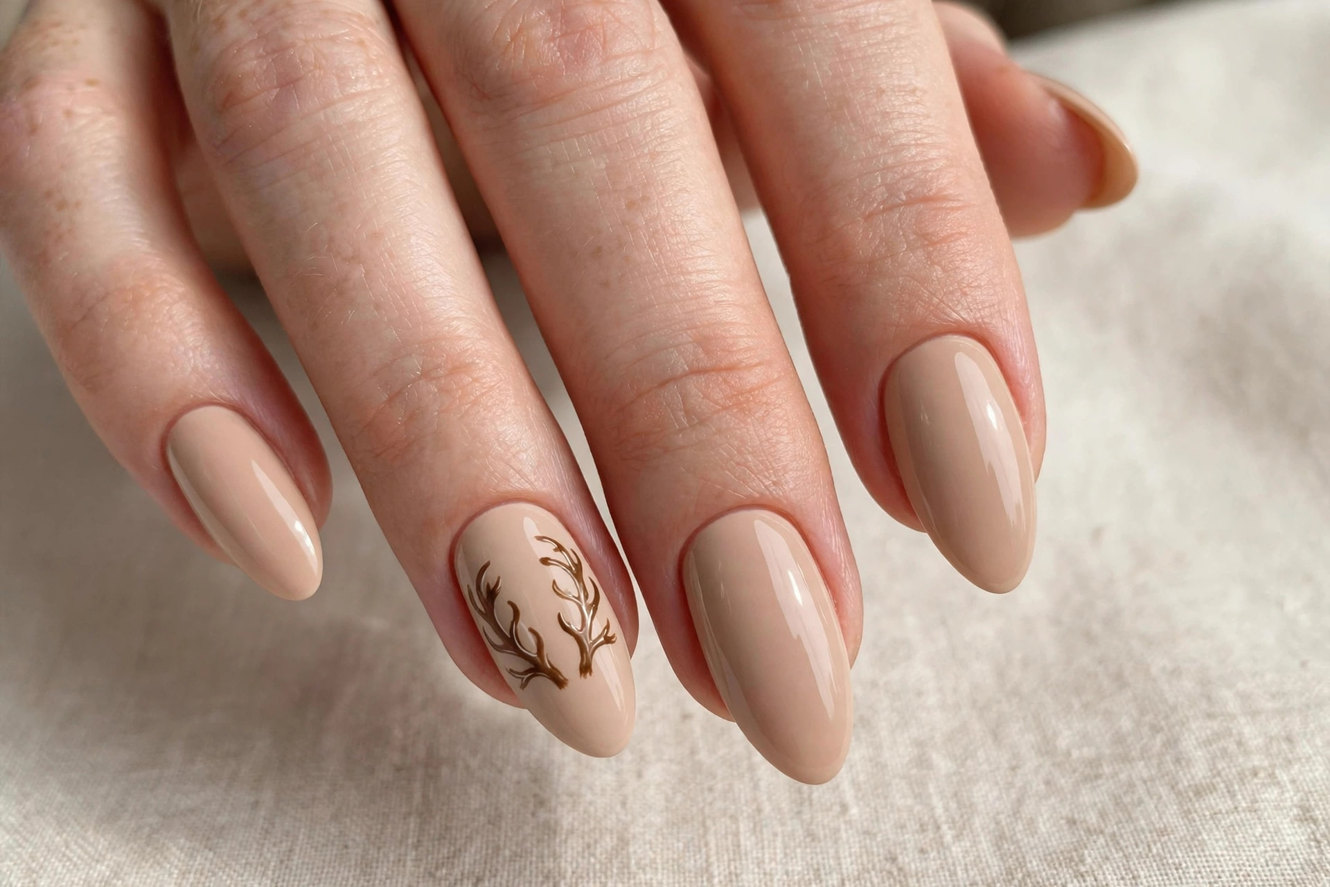 Nude nails with reindeer antler accent nail art