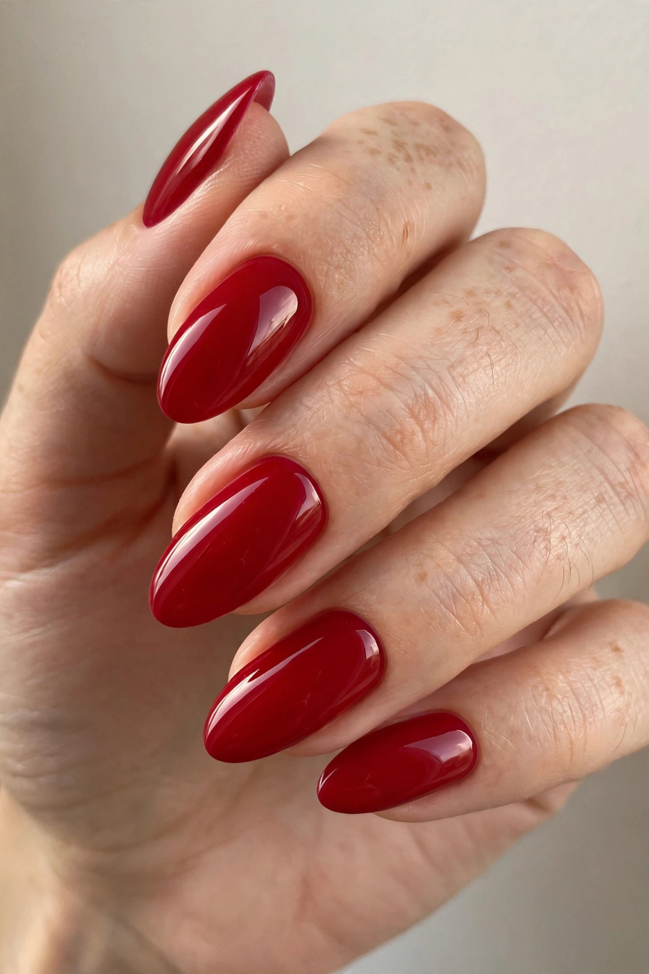 Candy apple red nails with ultra-glossy vivid red polish