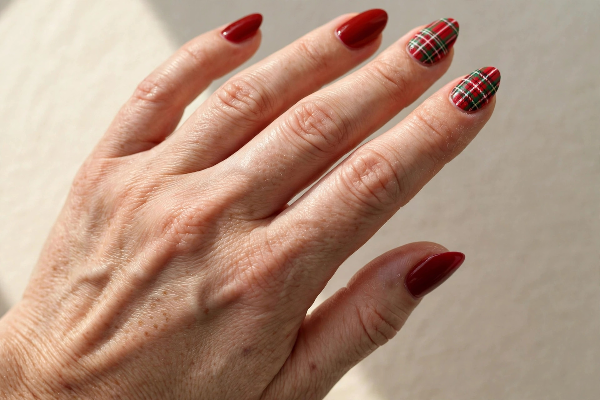 Red plaid tartan nail art with festive check pattern