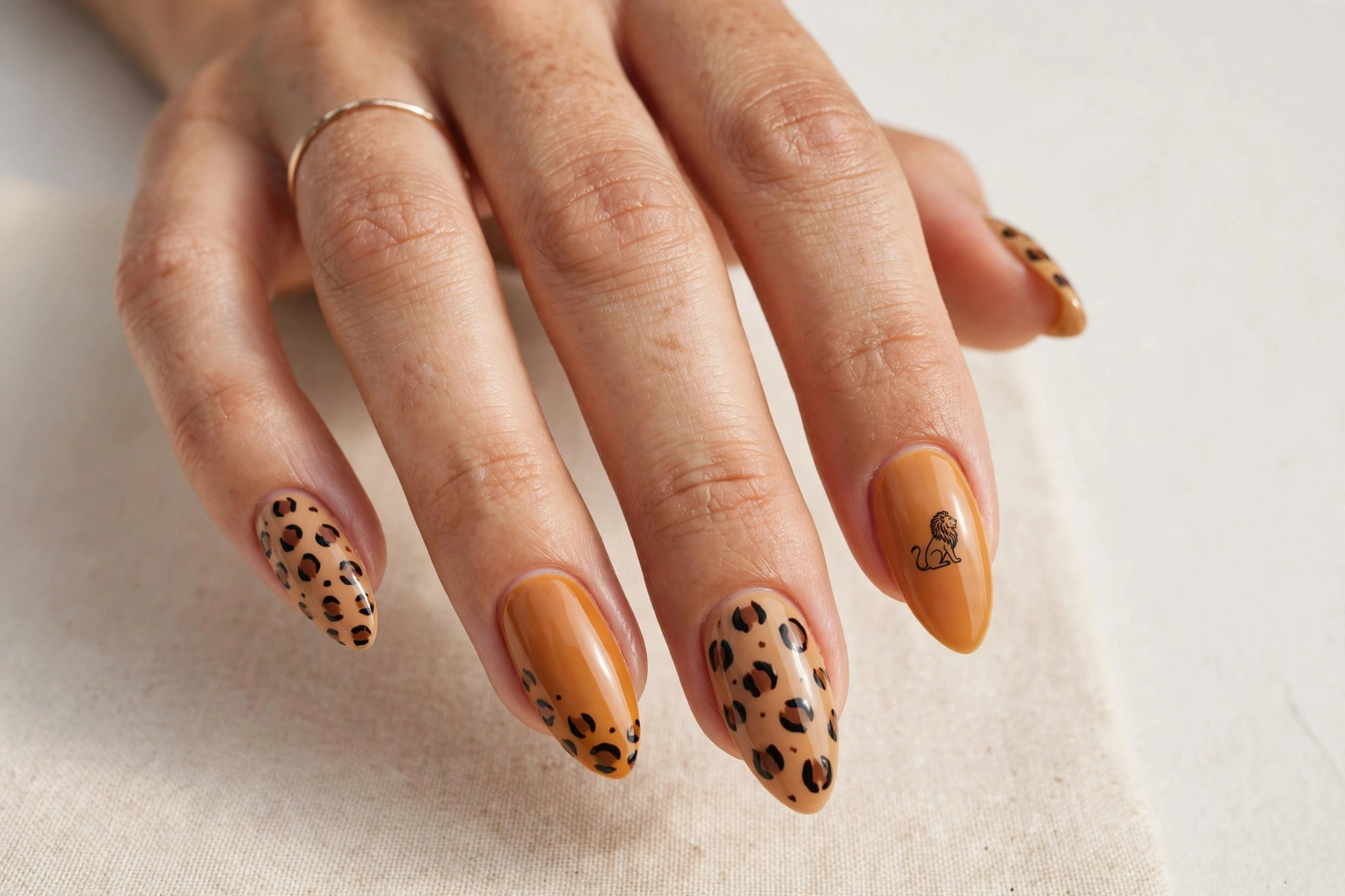 Tan nails with leopard print and safari silhouette accent