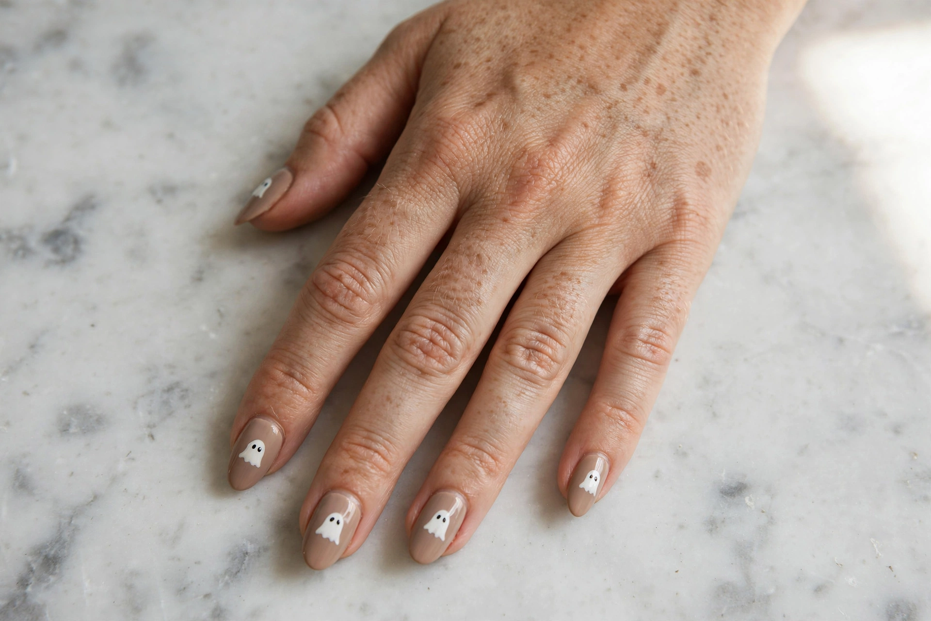 Easy Halloween designs for nails – friendly white ghost faces on nude nails