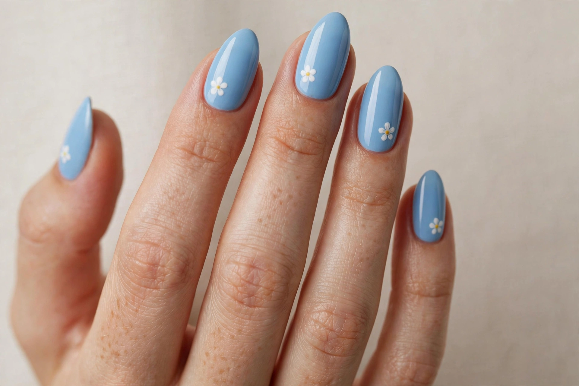 Sky blue nails with simple white flowers