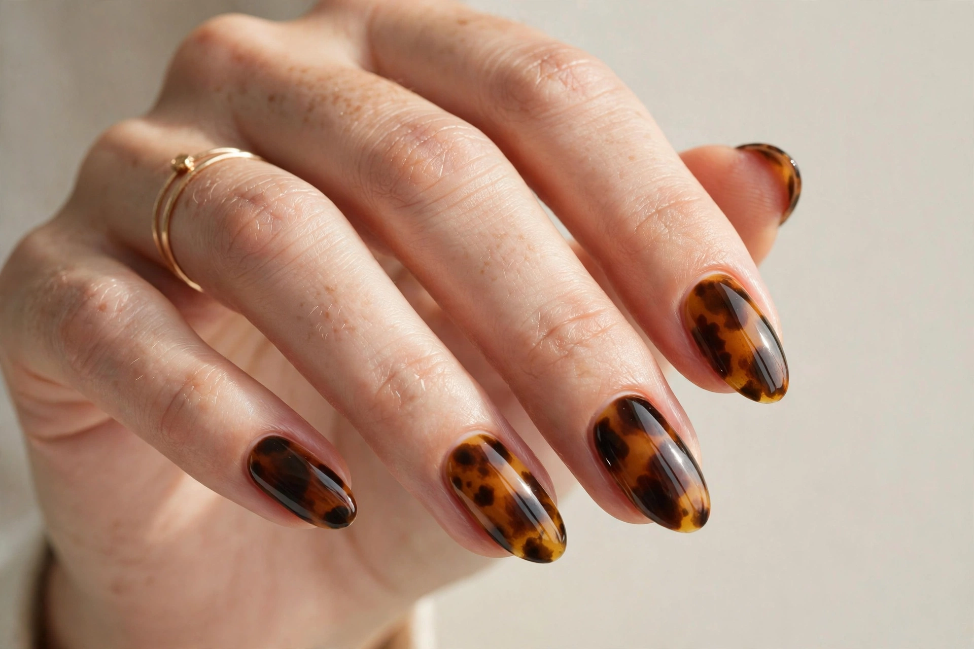 Almond shaped nails with tortoiseshell gel nail art