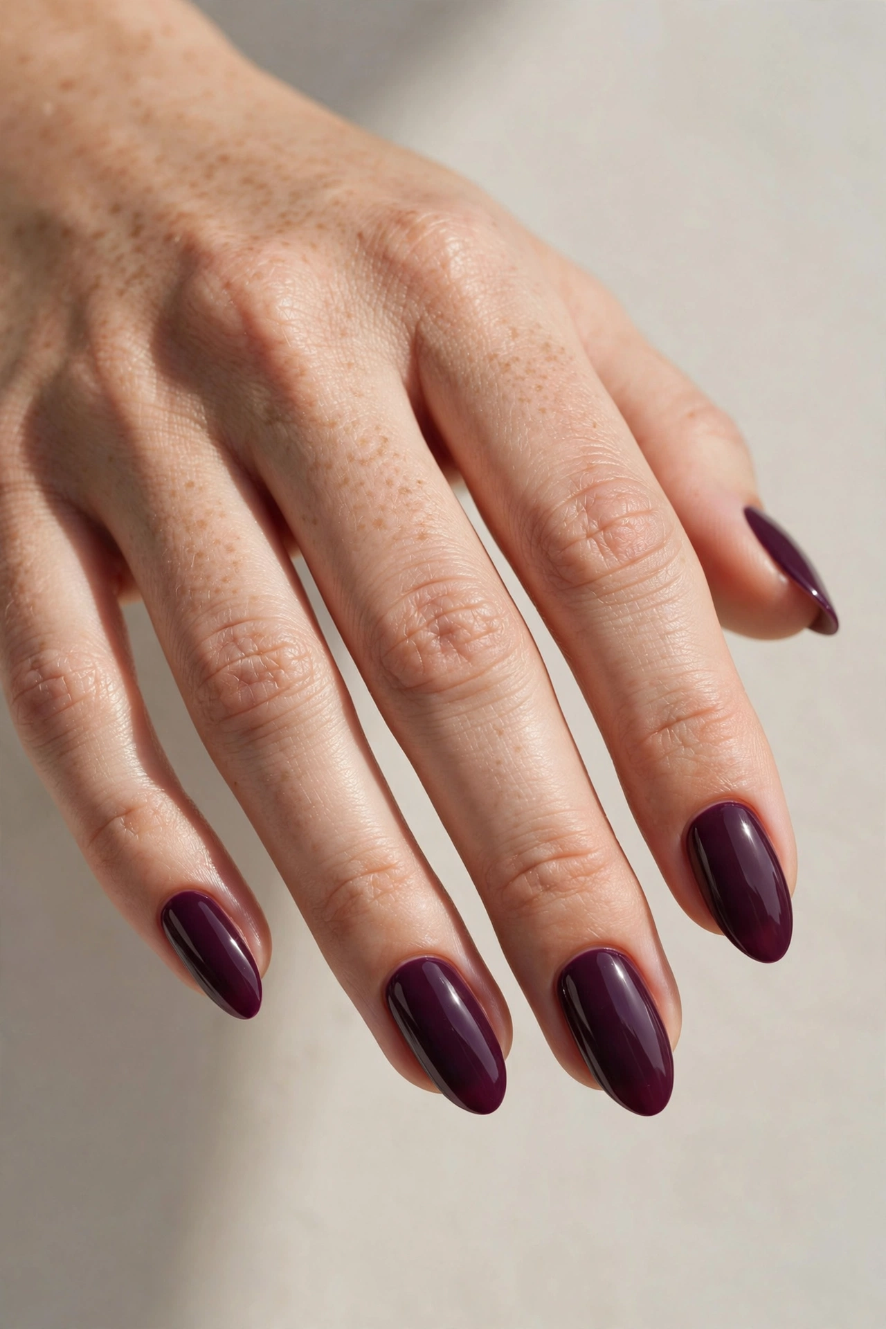Almond shaped nails with caramel swirl gel manicure