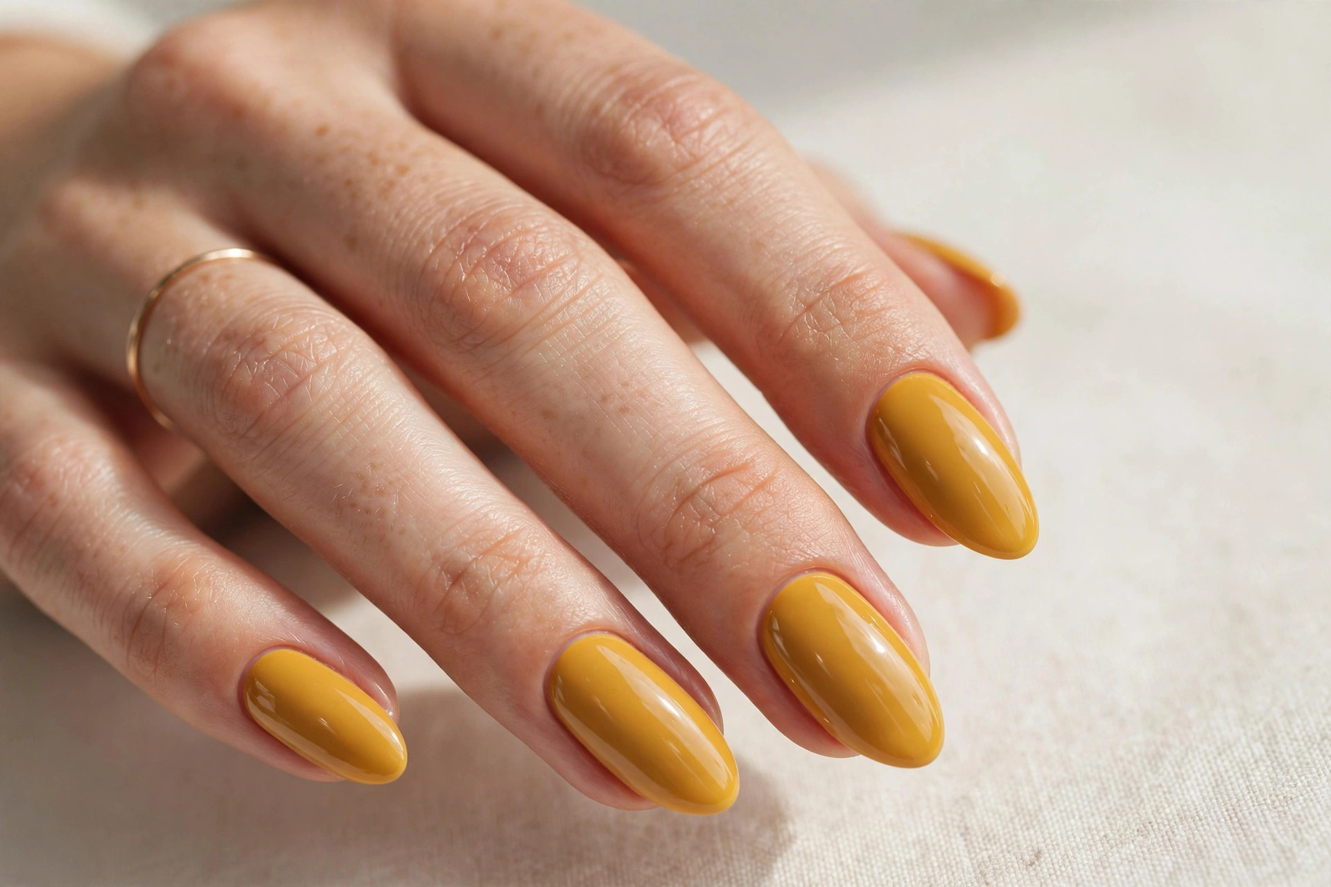 Warm mustard yellow fall nails on almond shaped nails