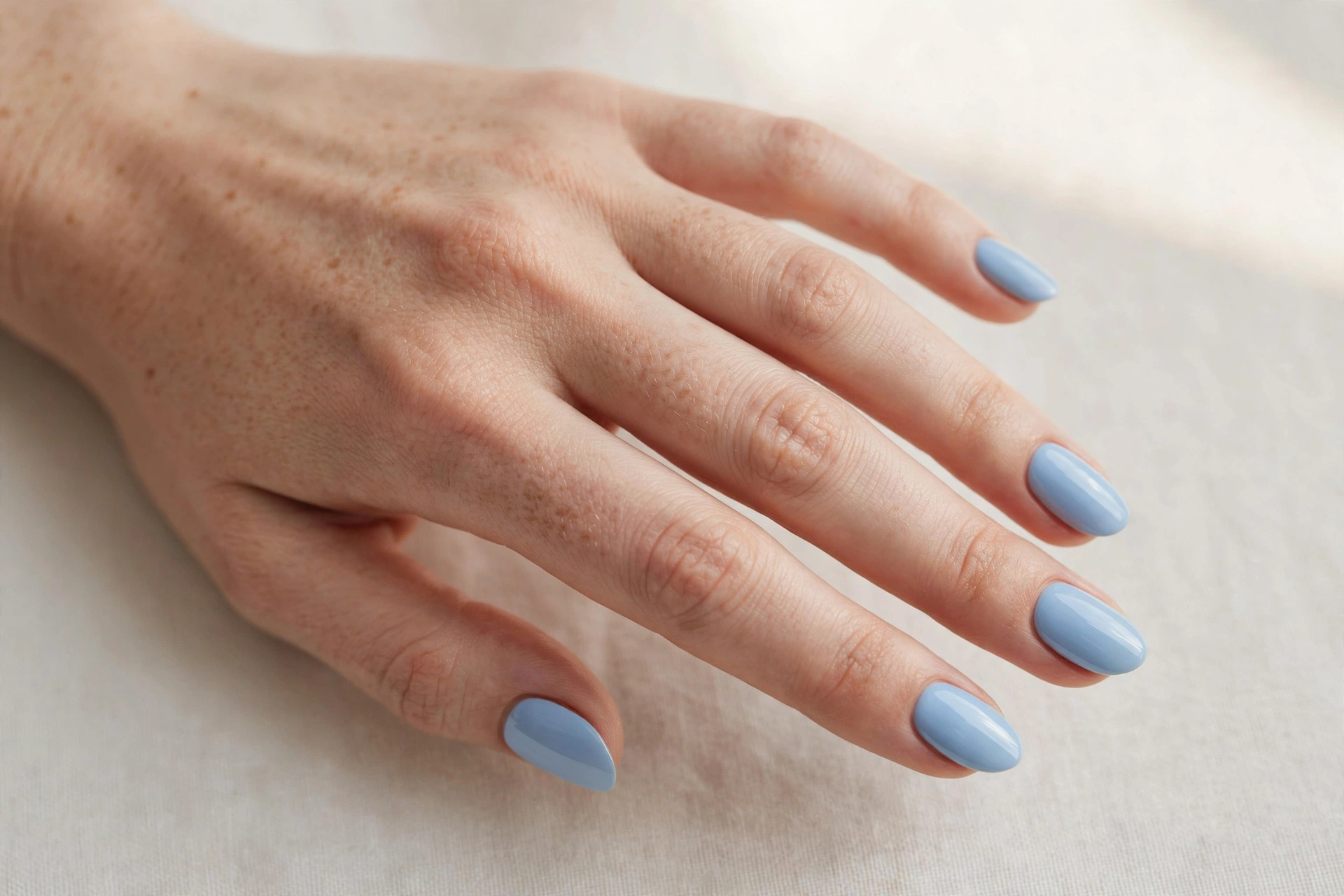 Baby blue solid polish manicure on short nails