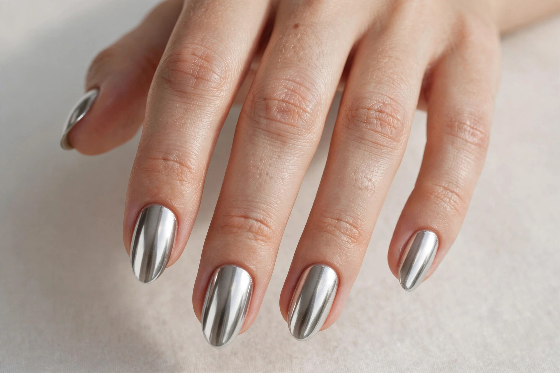 Metallic chrome gel nail design with mirror finish
