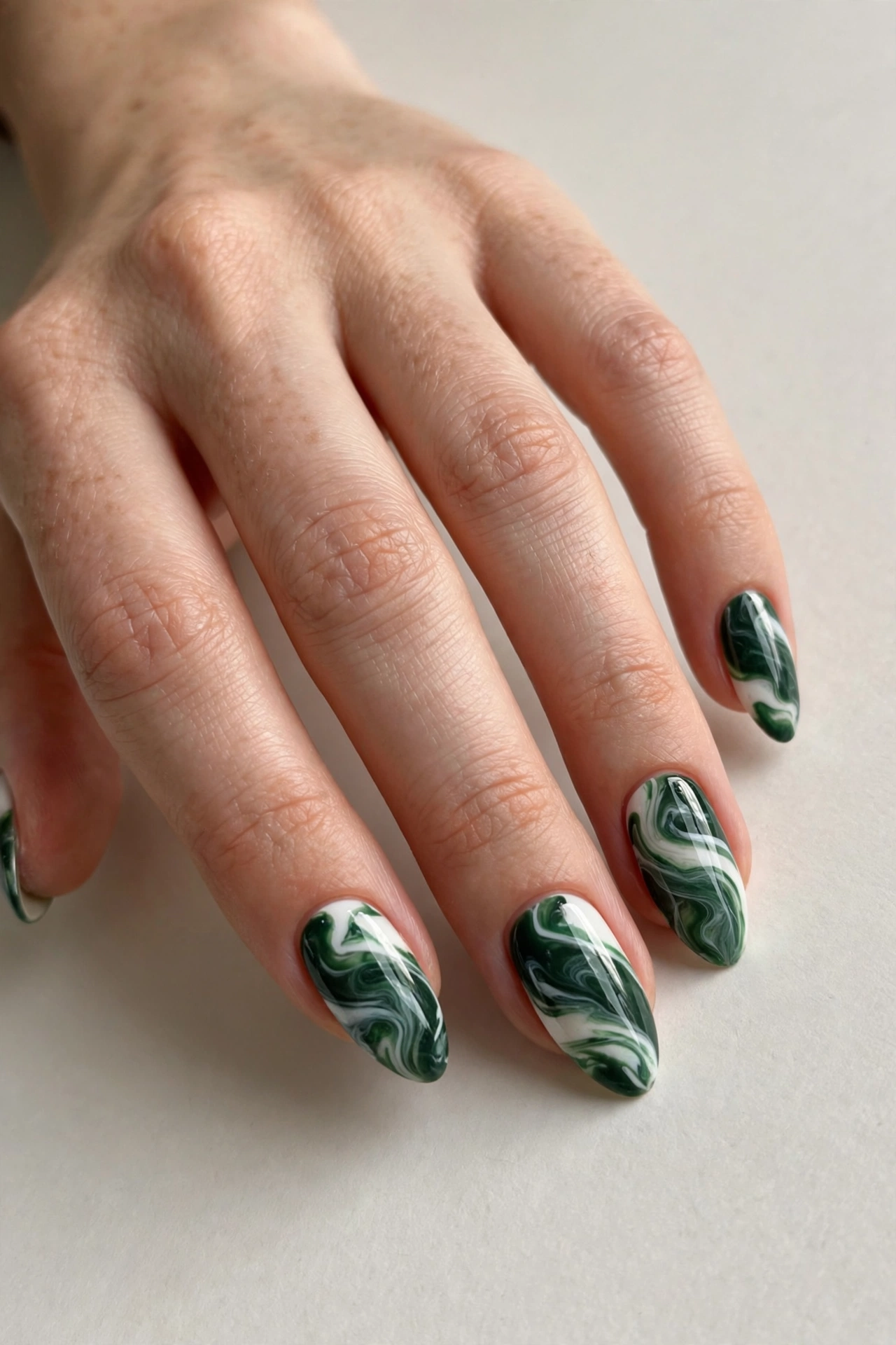 Forest green and white marble swirl Christmas nails
