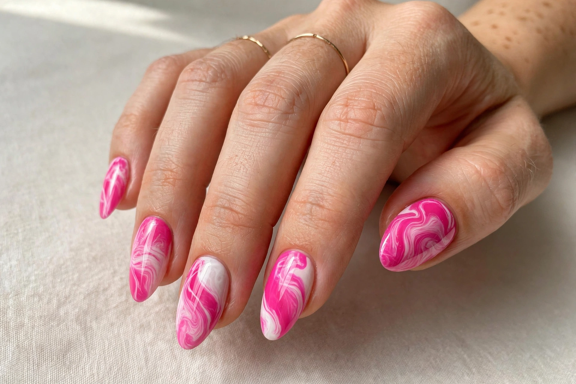 Hot pink and white marble swirl nail art