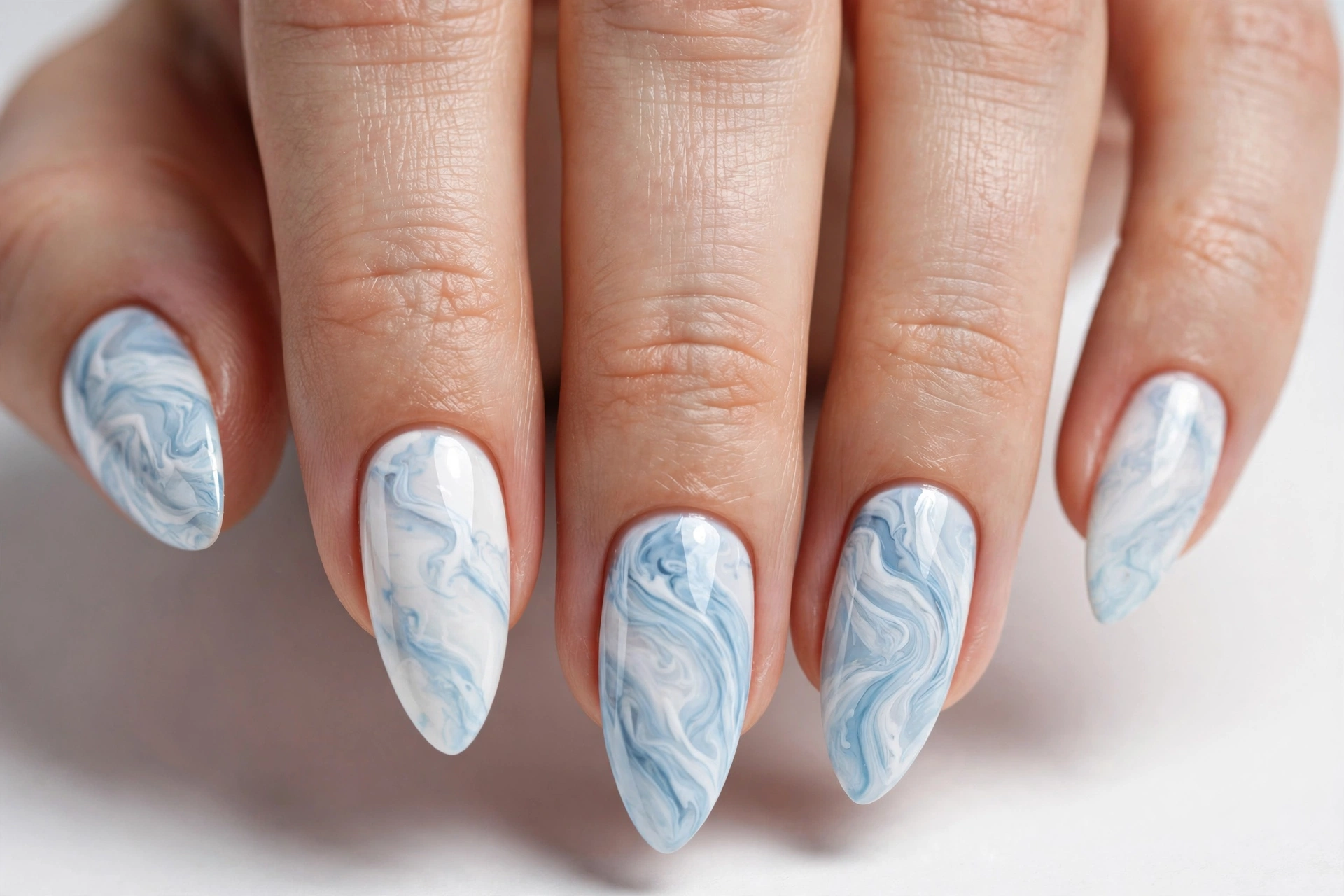 Light blue and white marble swirl nail art