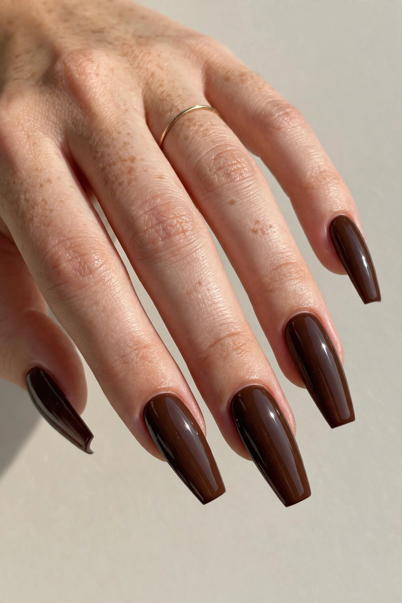 Espresso brown glossy manicure on long coffin shaped nails