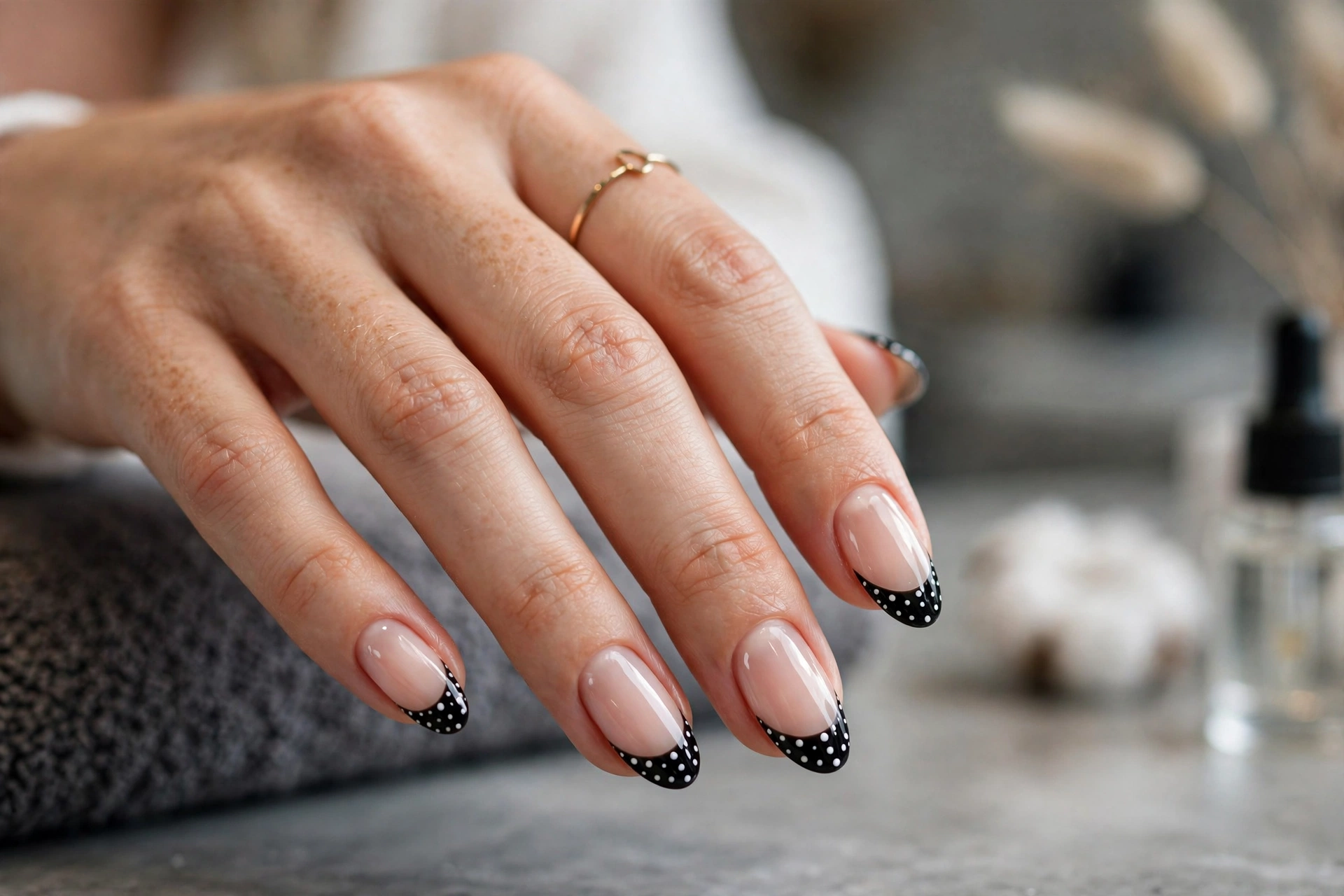 Black and white polka dot French tip nails