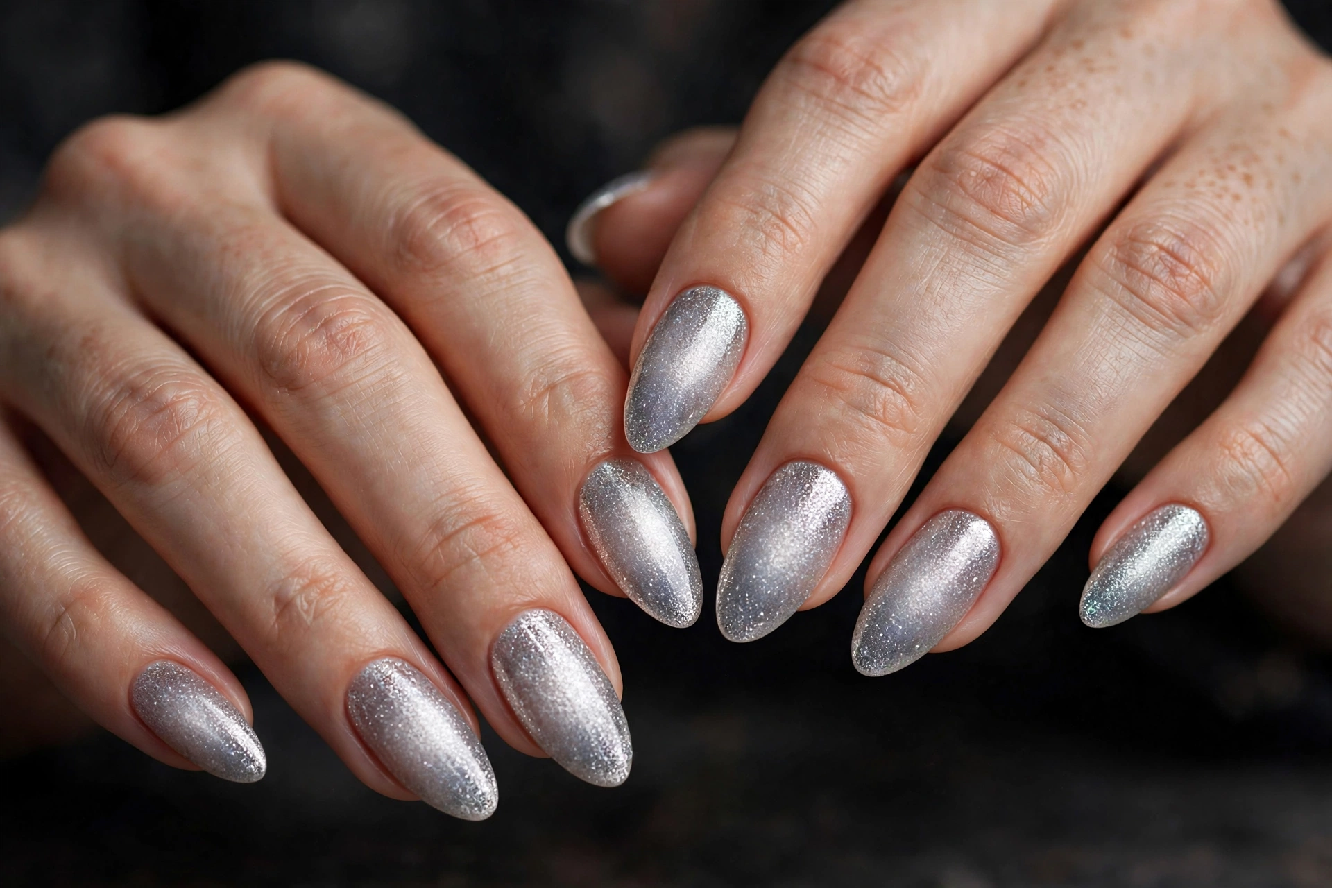 Silver glitter aura ombré glowing from the center of each nail