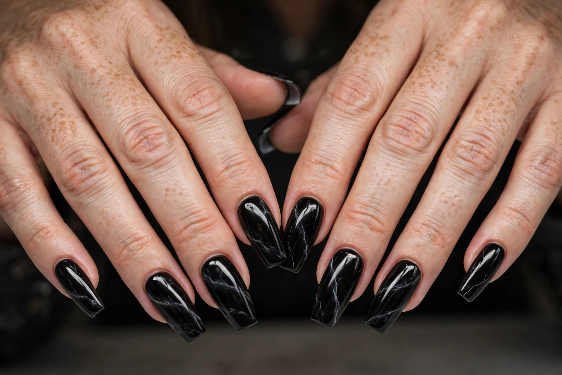 Glossy black onyx stone nails with subtle white marble veining