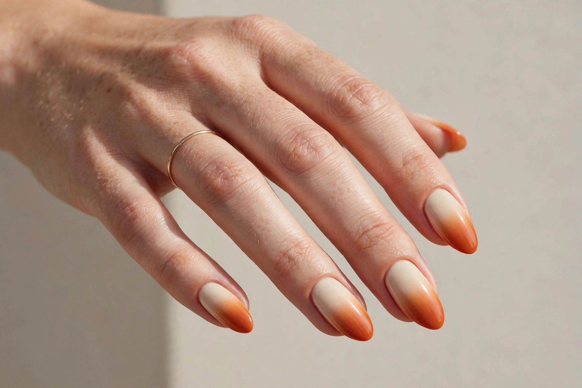 Pumpkin spice ombre nails fading from cream to burnt orange