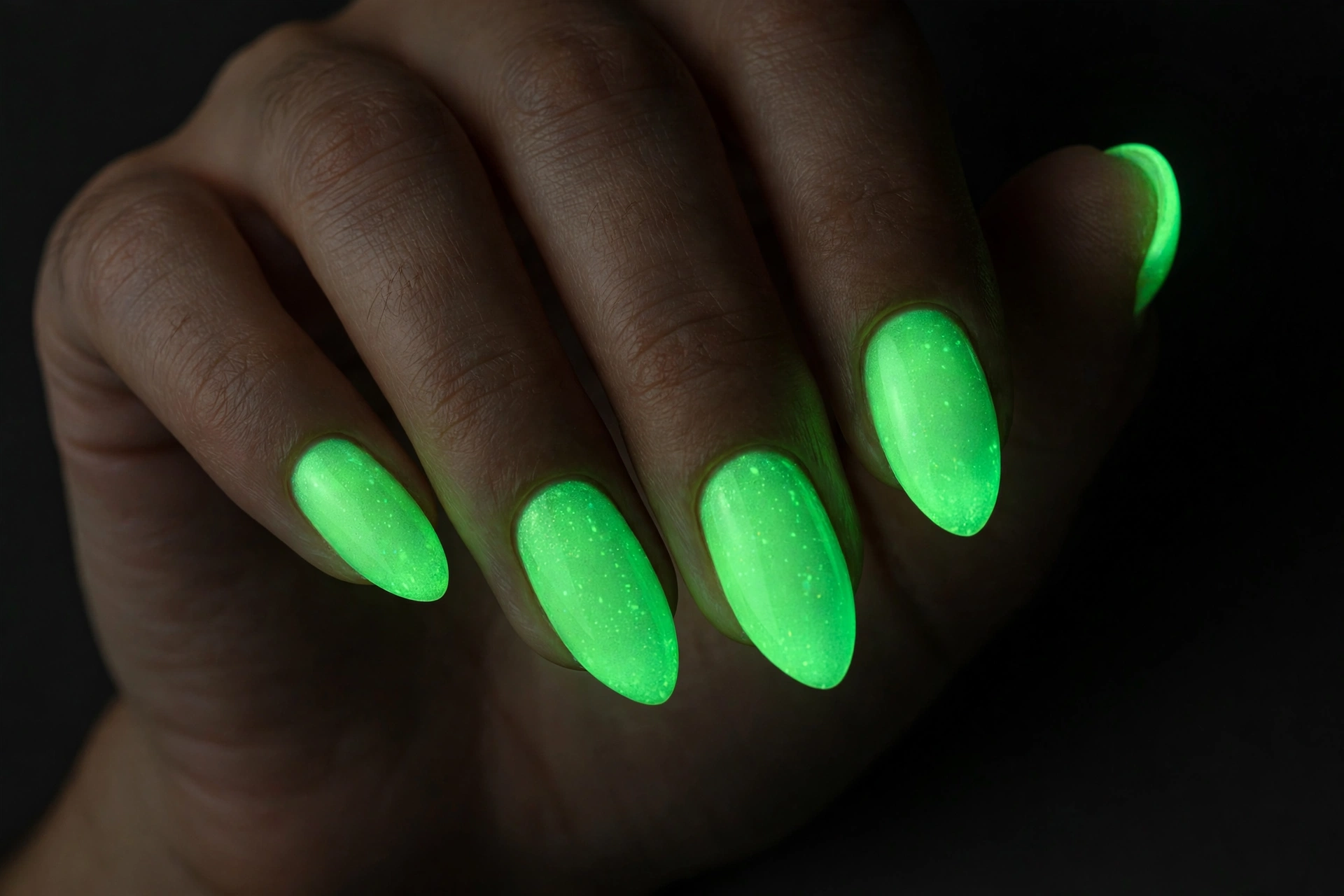 Neon green glow in the dark nail polish on almond nails