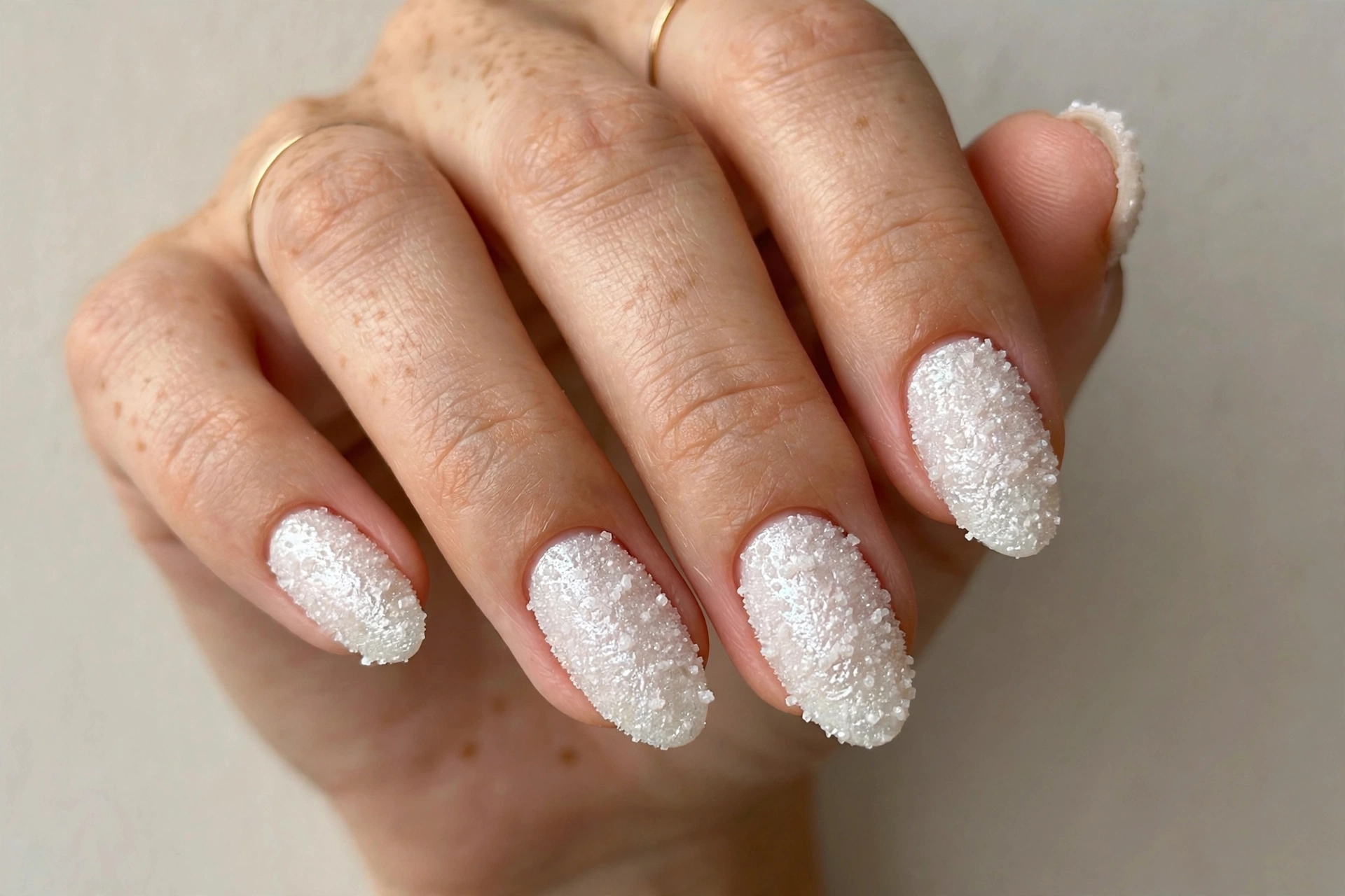 Frosted pearl sugar effect manicure with textured finish