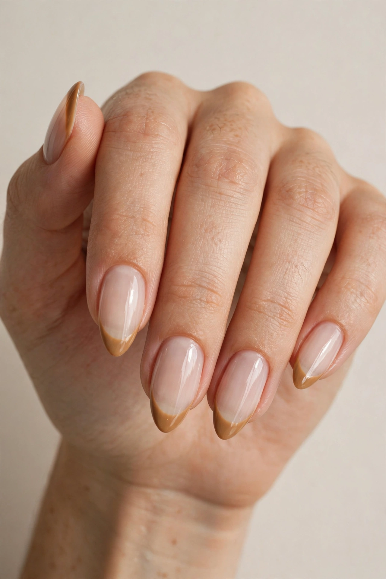 Iced latte French tip nails with caramel tips on milky sheer base