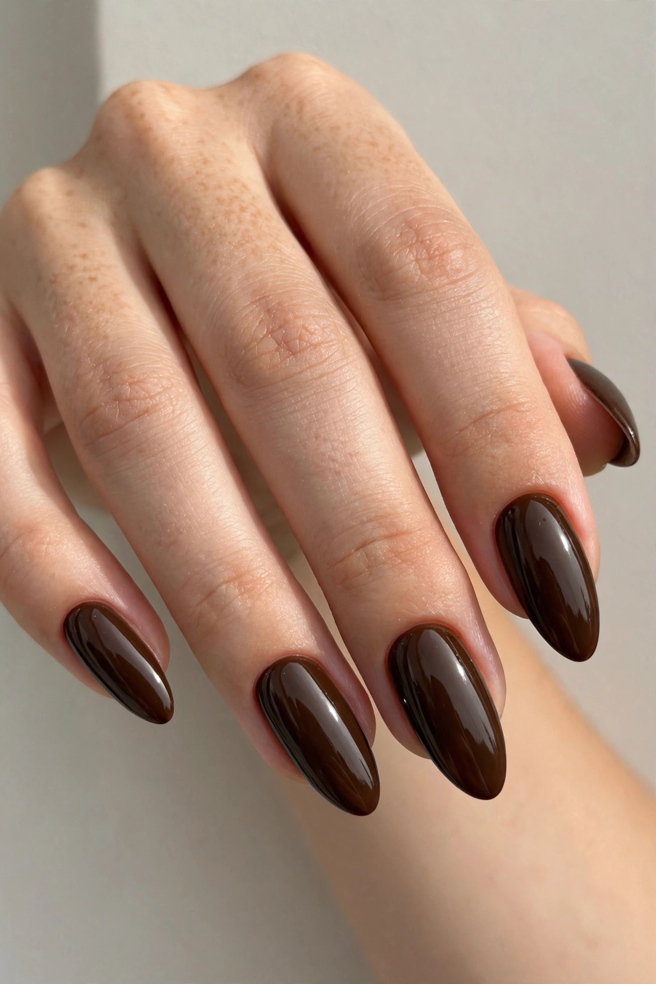 Deep roast almond nails with dark roast coffee-brown glossy polish