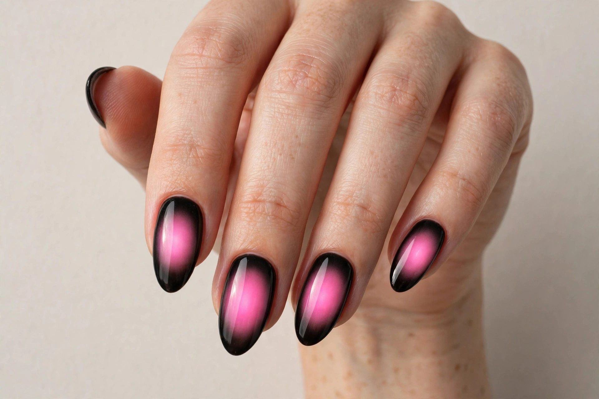 Black aura almond nails with glowing pink centers