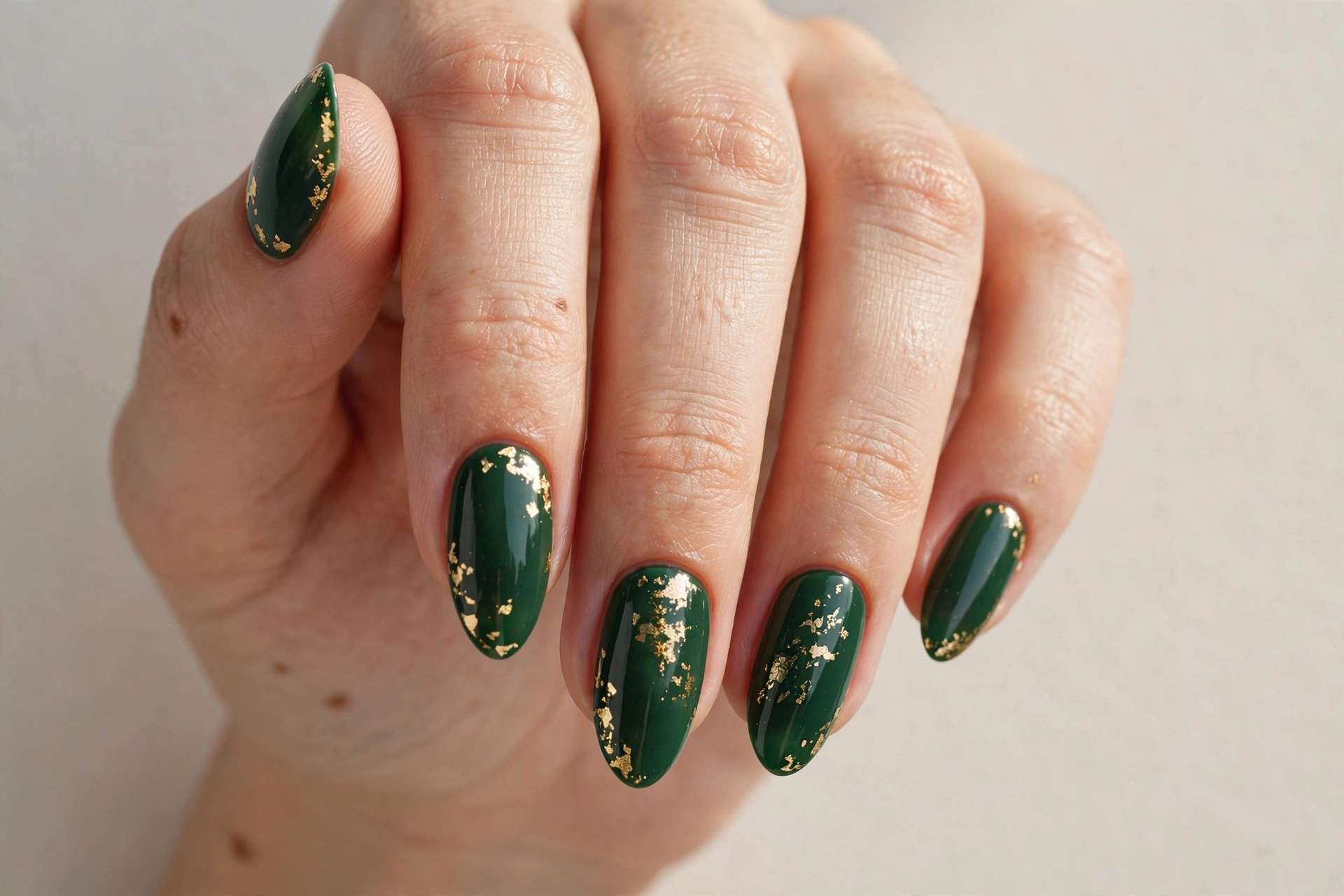 Forest green nails with gold leaf details