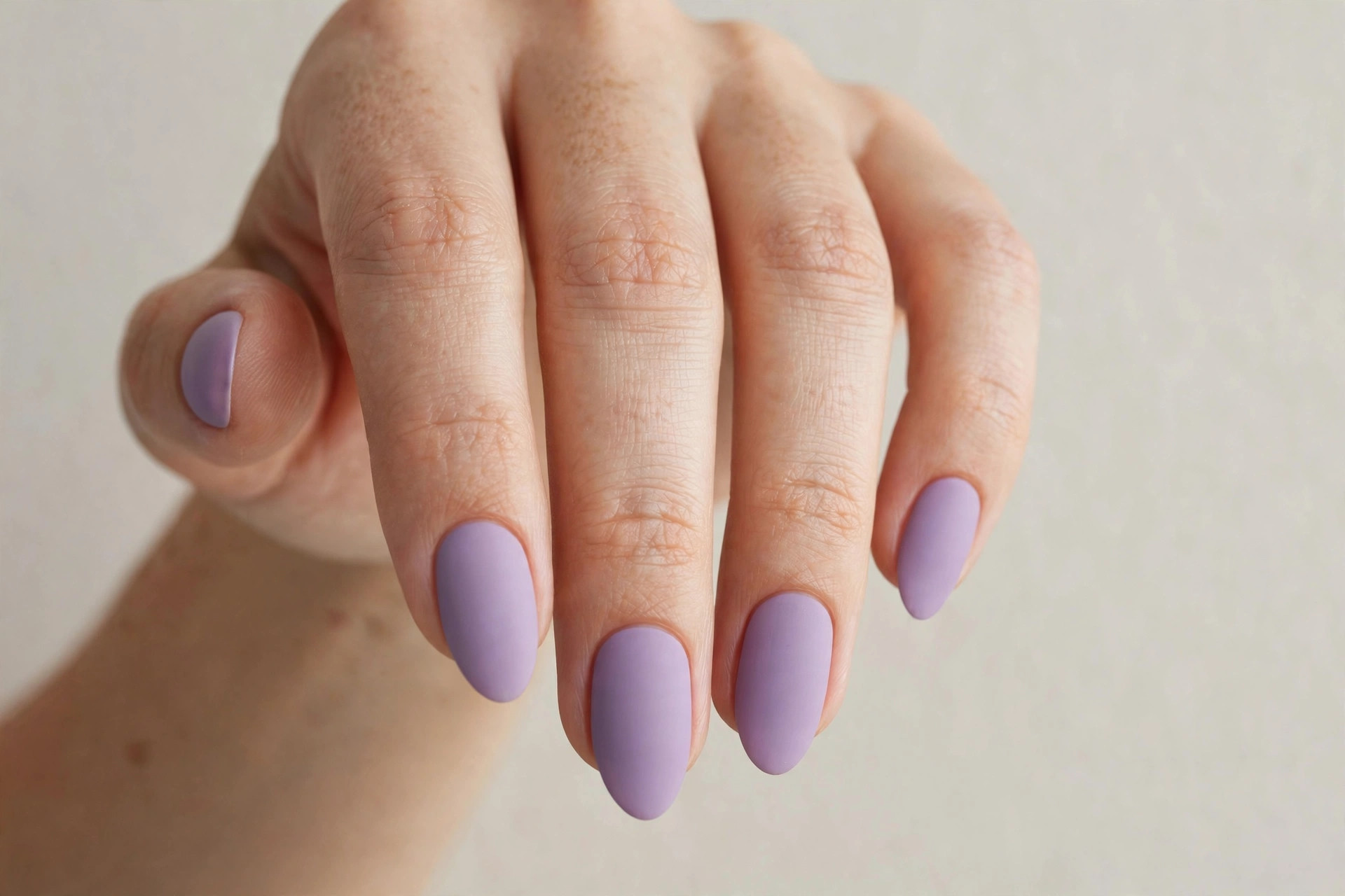 Soft lavender matte purple manicure on almond nails