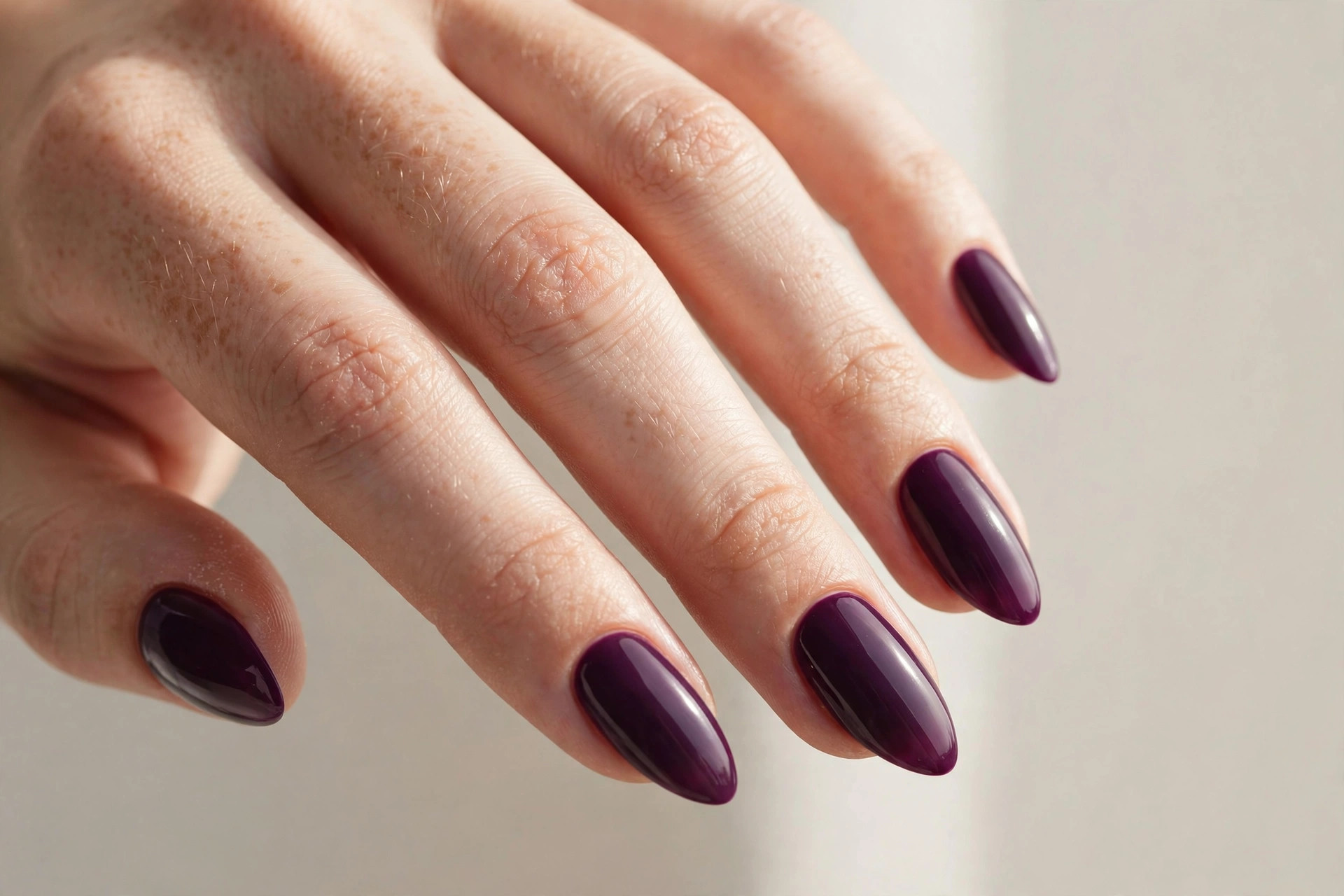 Dark plum purple almond shaped nail manicure