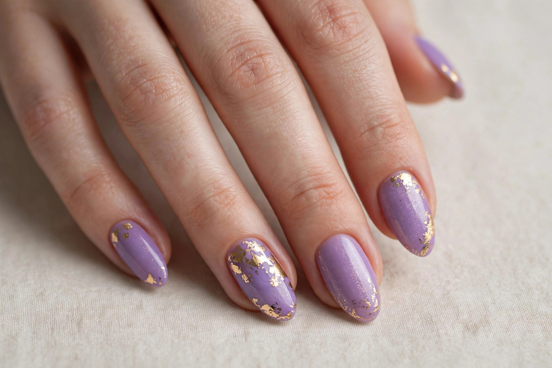 Lilac purple manicure with gold foil accents