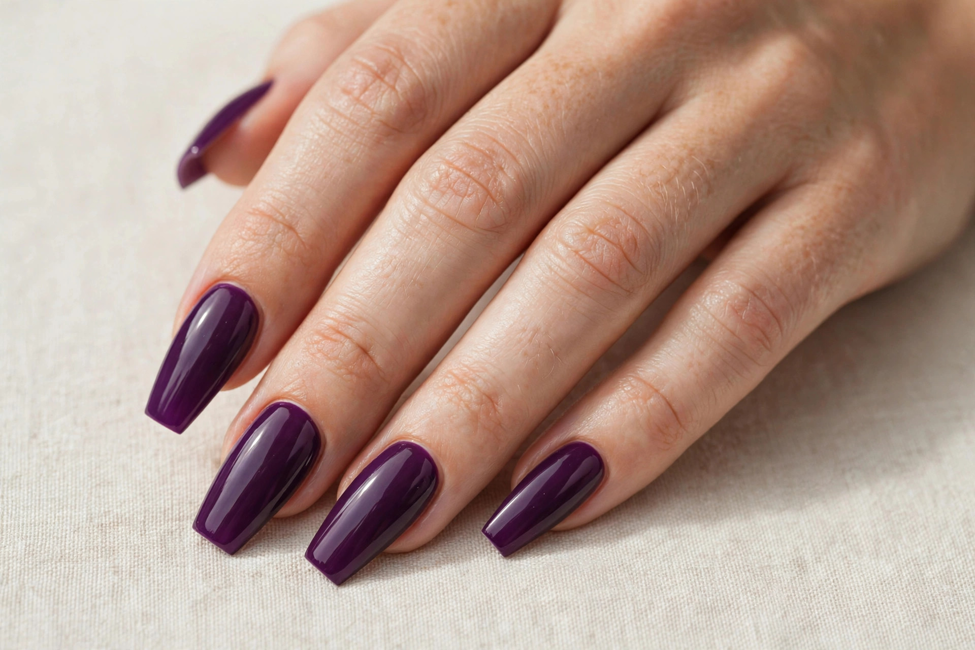 Rich grape purple coffin shaped nail manicure