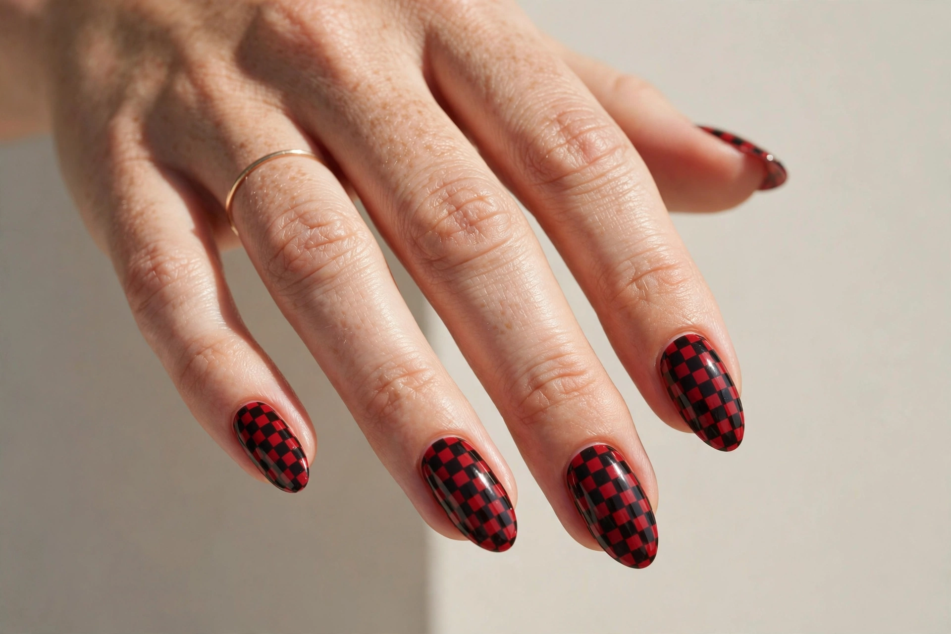 Red and black checkerboard pattern nails