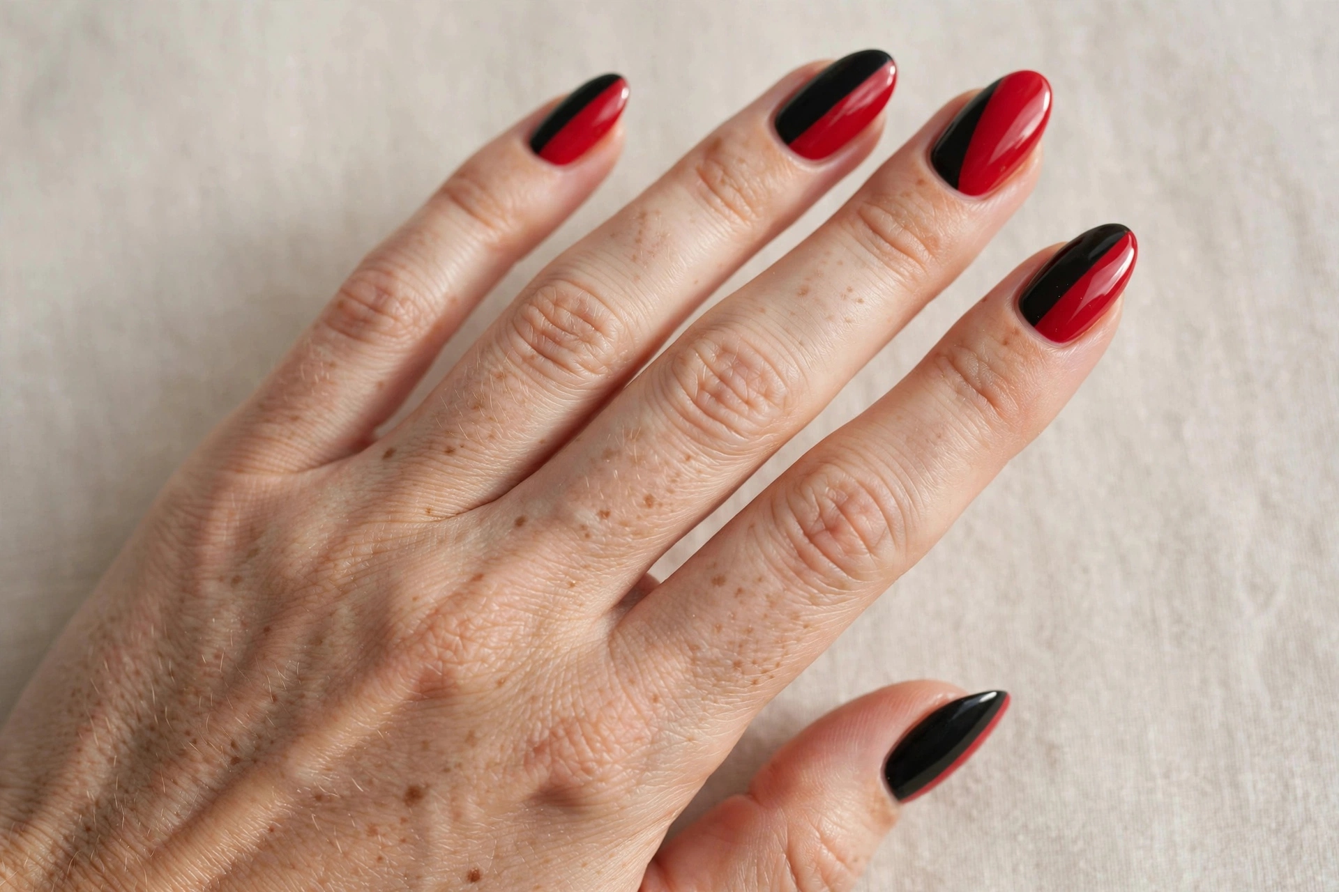 Red and black diagonal color block nails