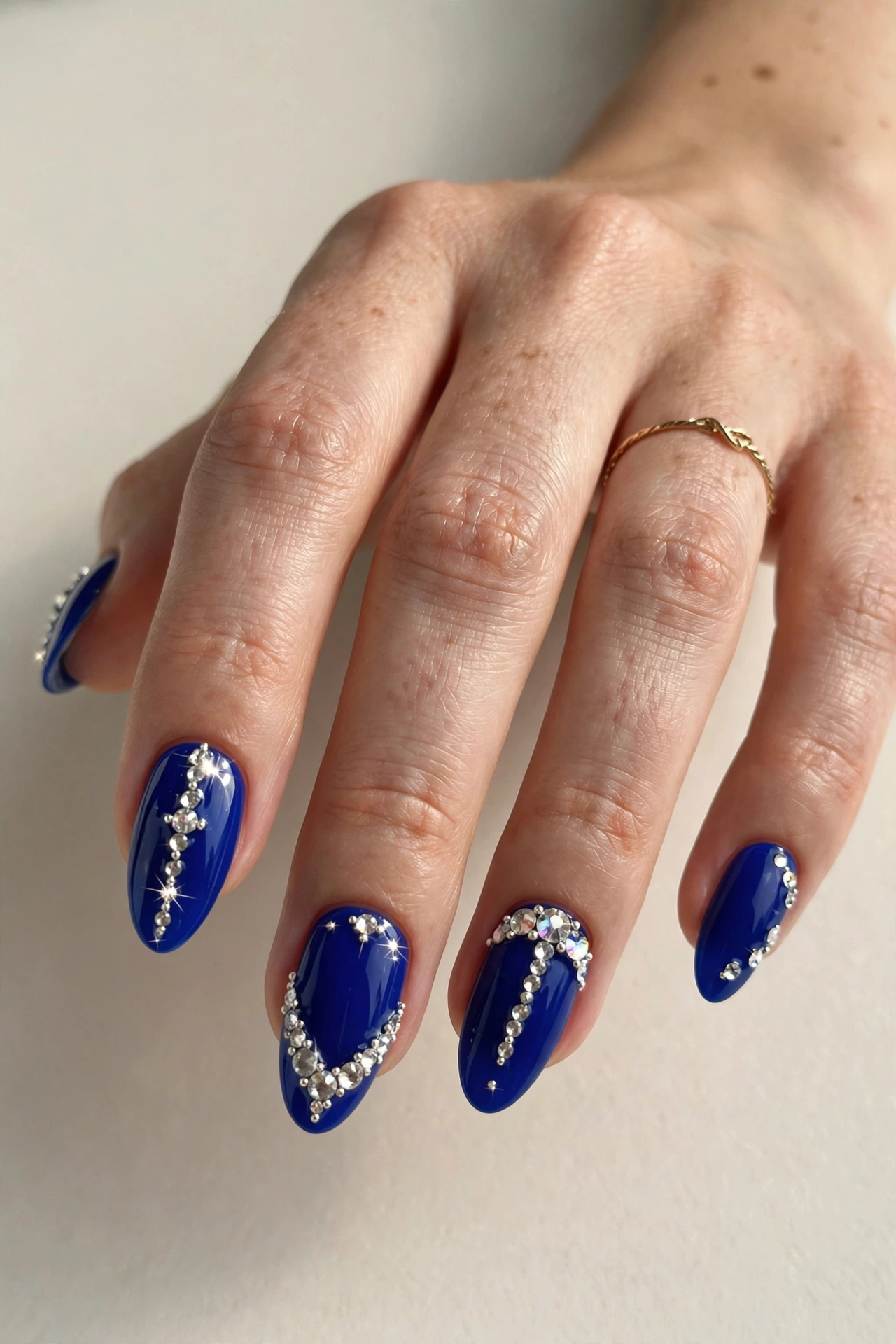 Royal blue nails with crystal rhinestones