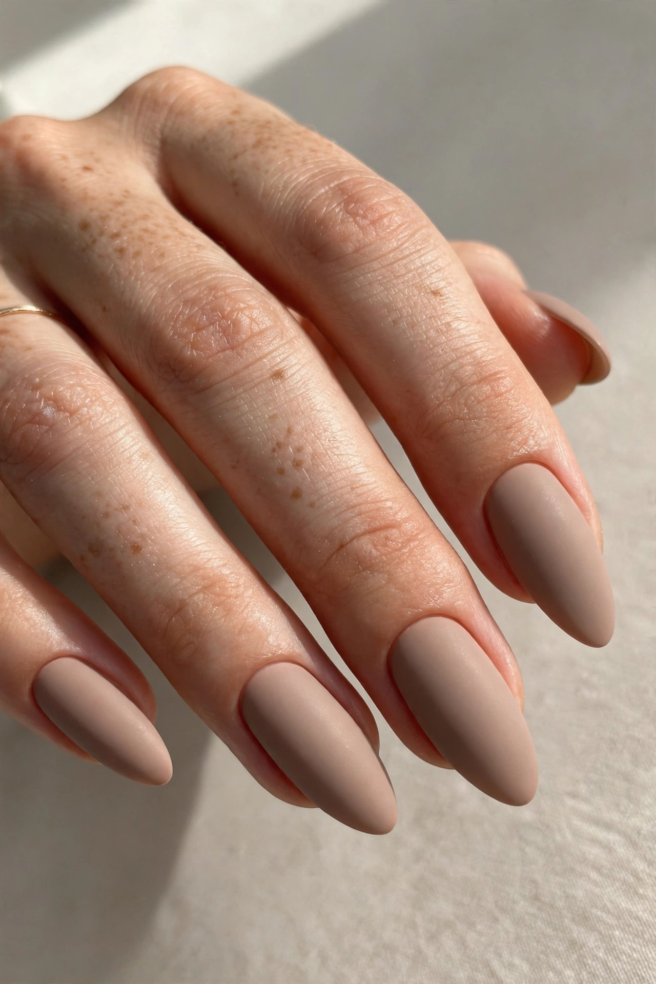 Satin matte nude taupe manicure on russian almond shaped nails