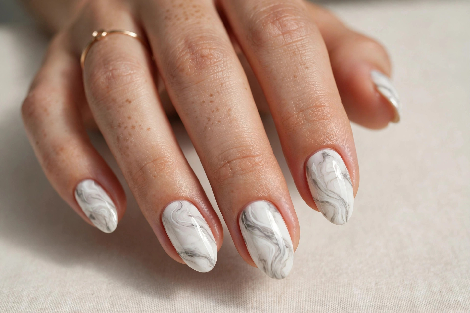 White marble swirl nail art with grey veining