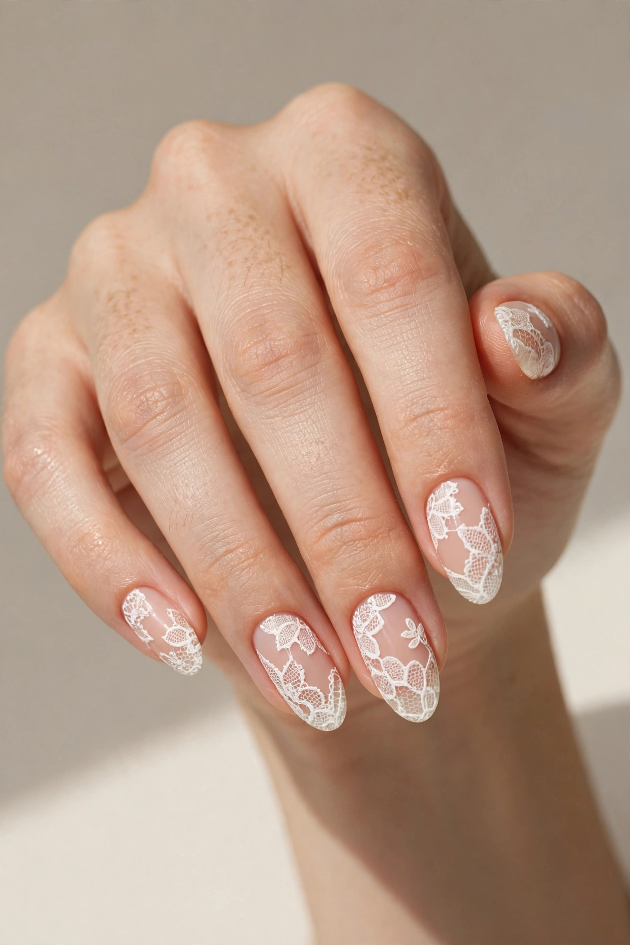 White lace patterned nail art with delicate details