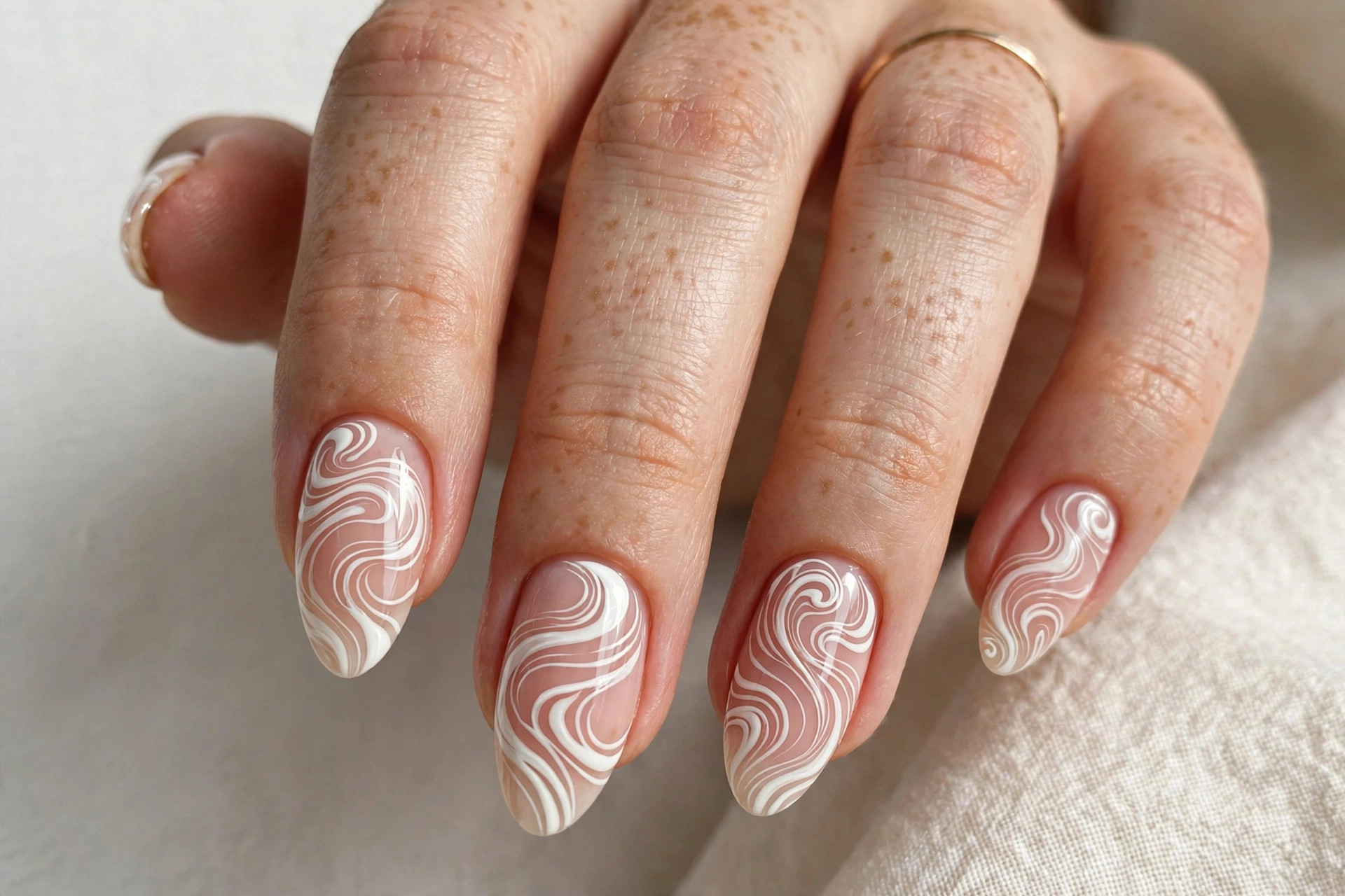 White abstract swirl wave nail art with flowing curves